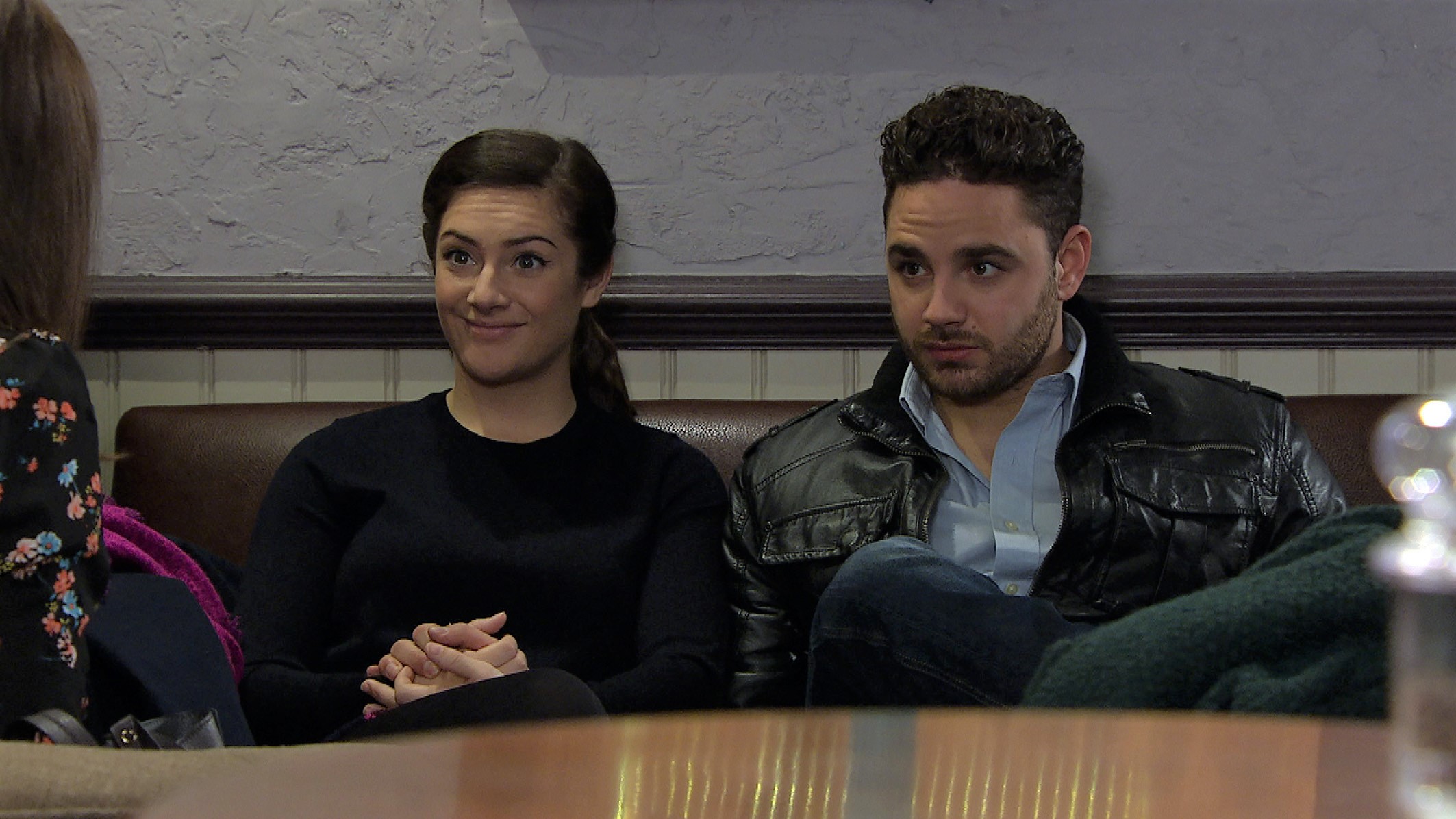 Emmerdale Victoria smiles as Adam looks worried talking to the social worker