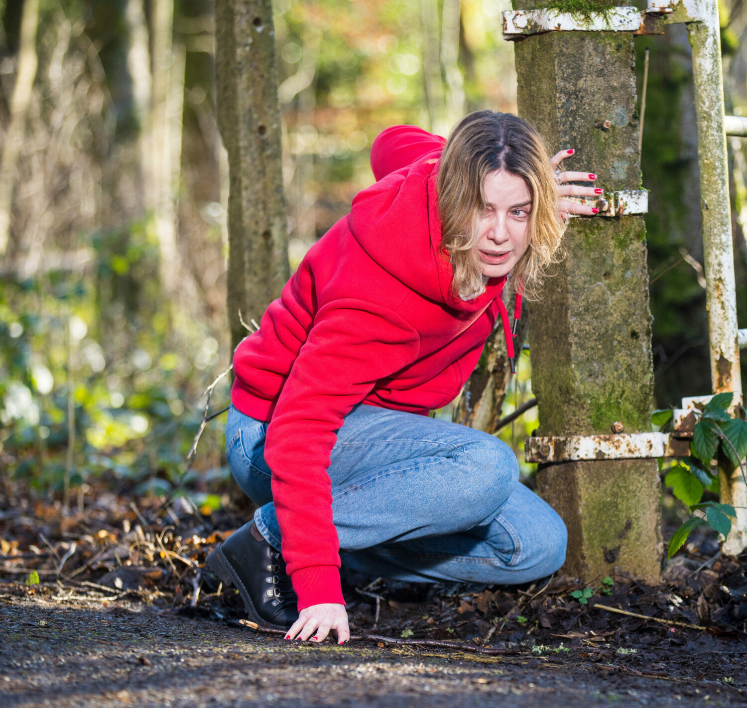 Coronation Street Abi crouches on the side of the road in agony
