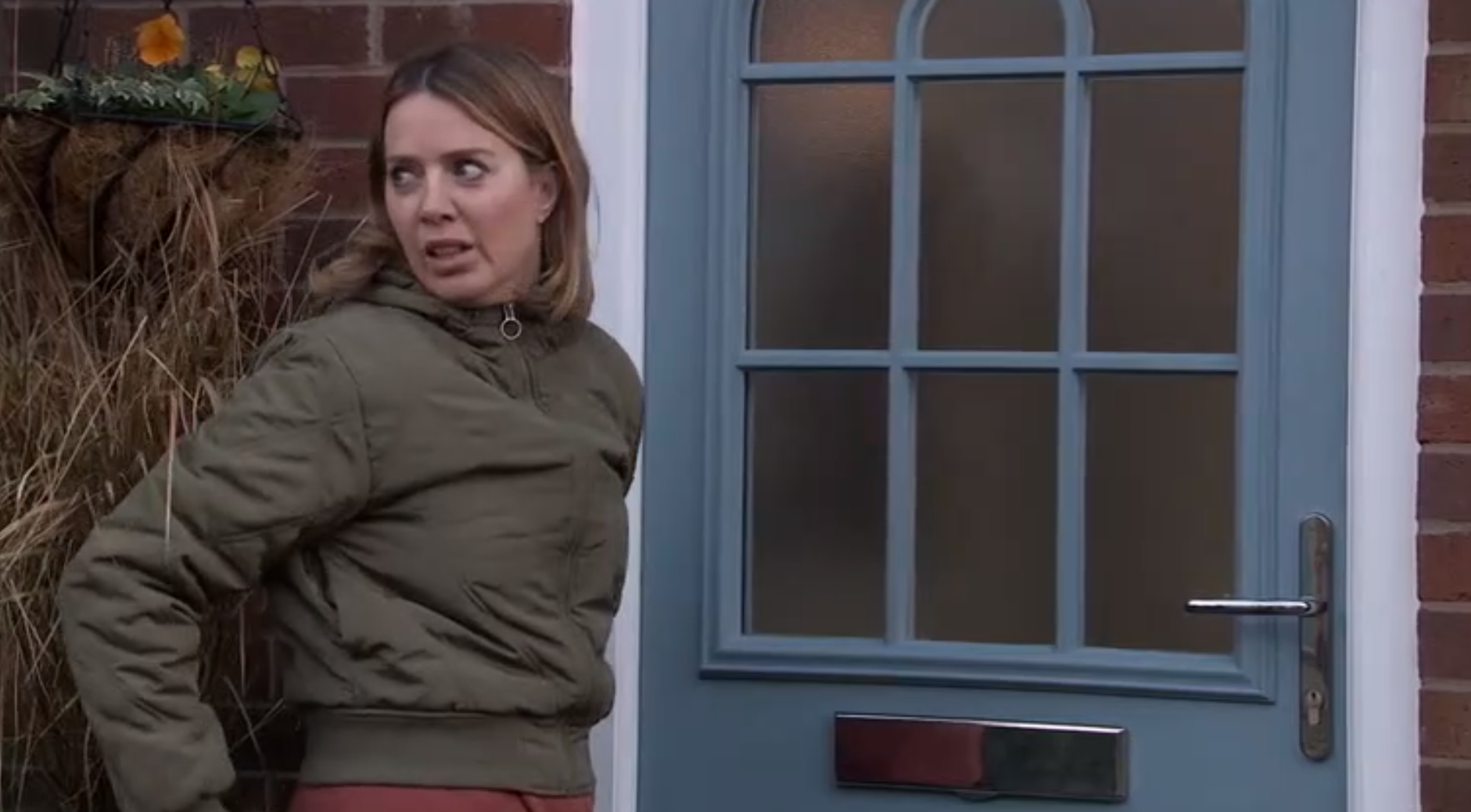 Coronation Street Abi looks worried at Sally's front door