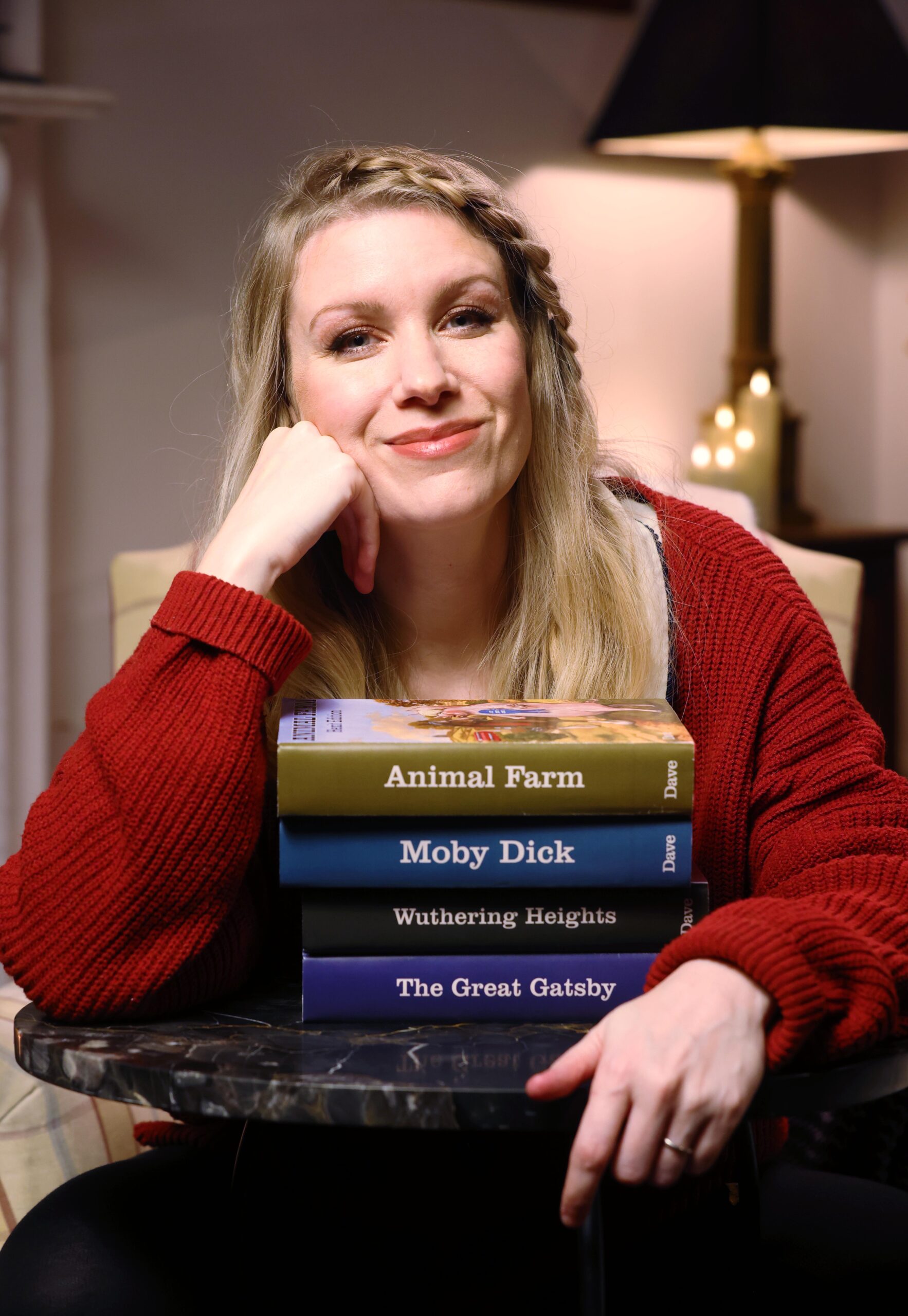 Woman with a stack of books