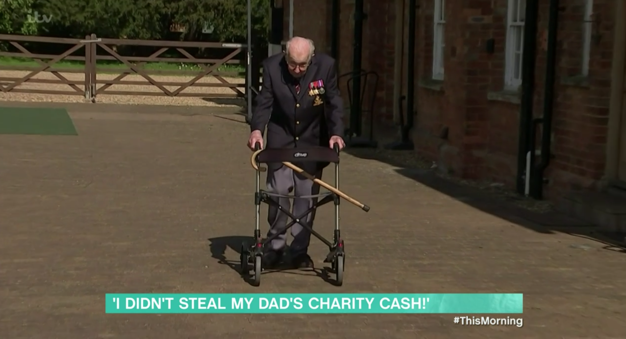 Captain Sir Tom Moore walking