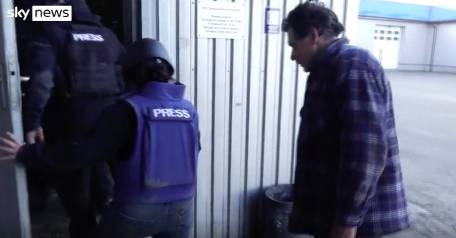 The Sky News team take refuge in a factory unit