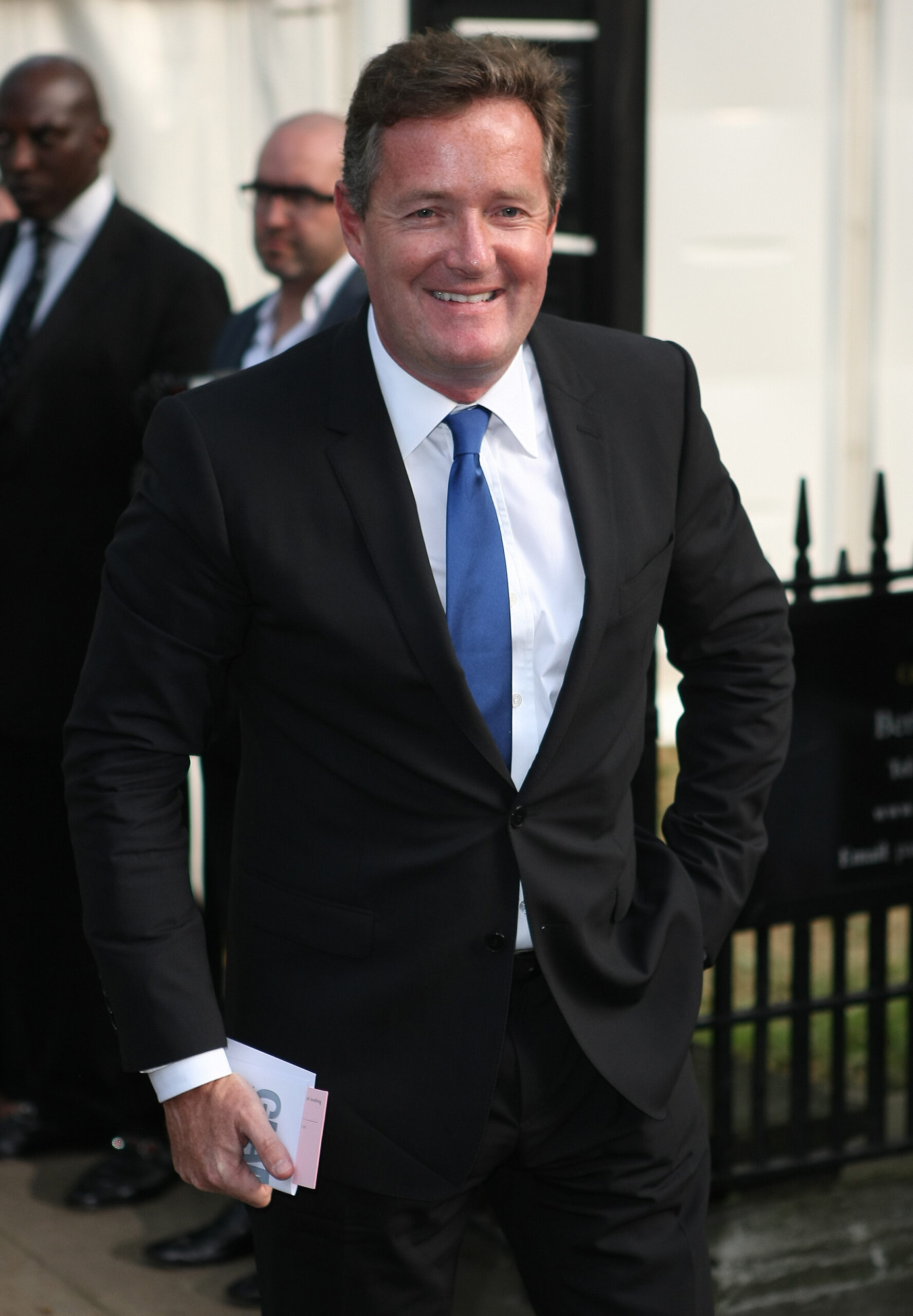 piers Morgan siling in a suit