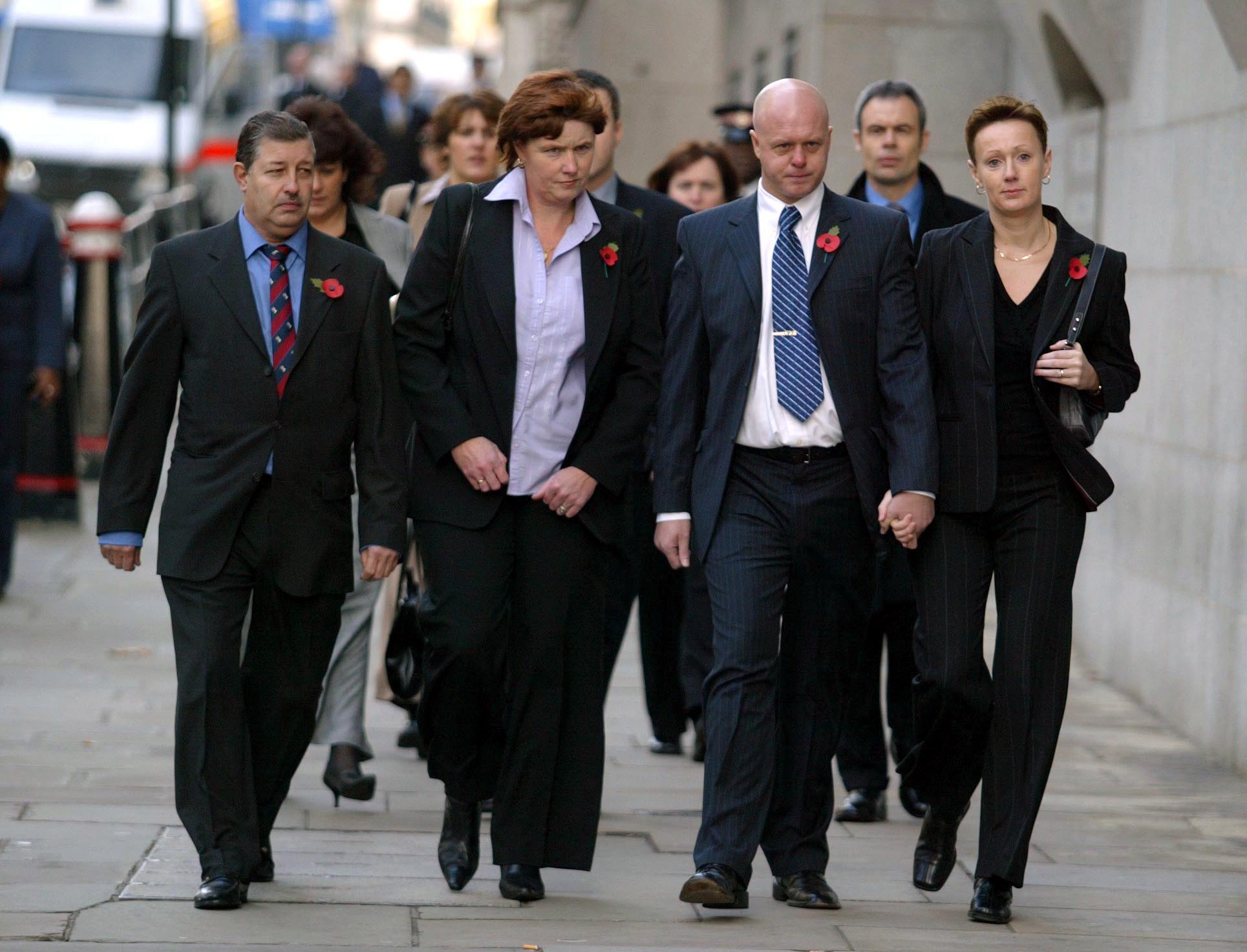 Holly and Jessica's parents while they were missing