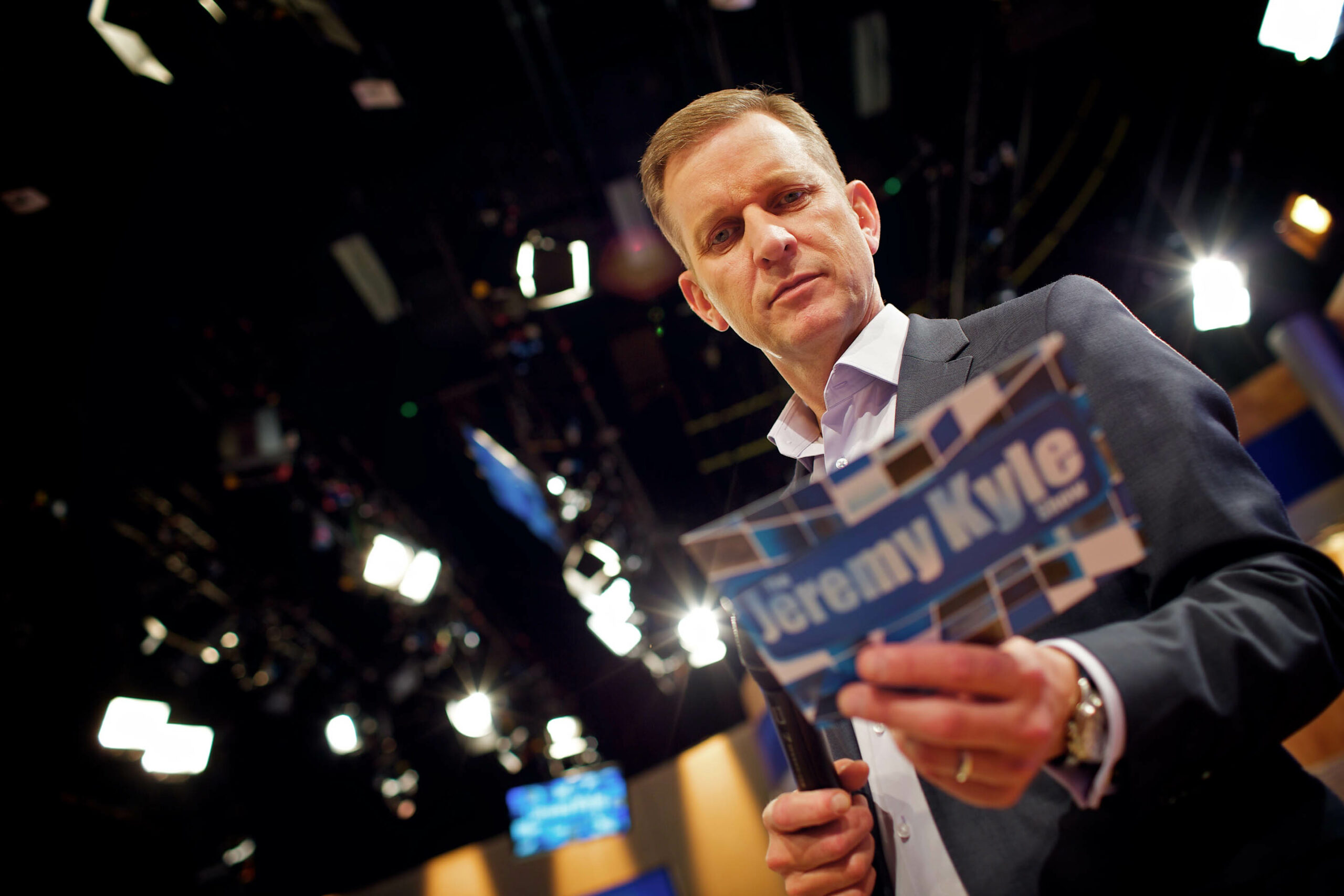 Jeremy Kyle holding cards on his show