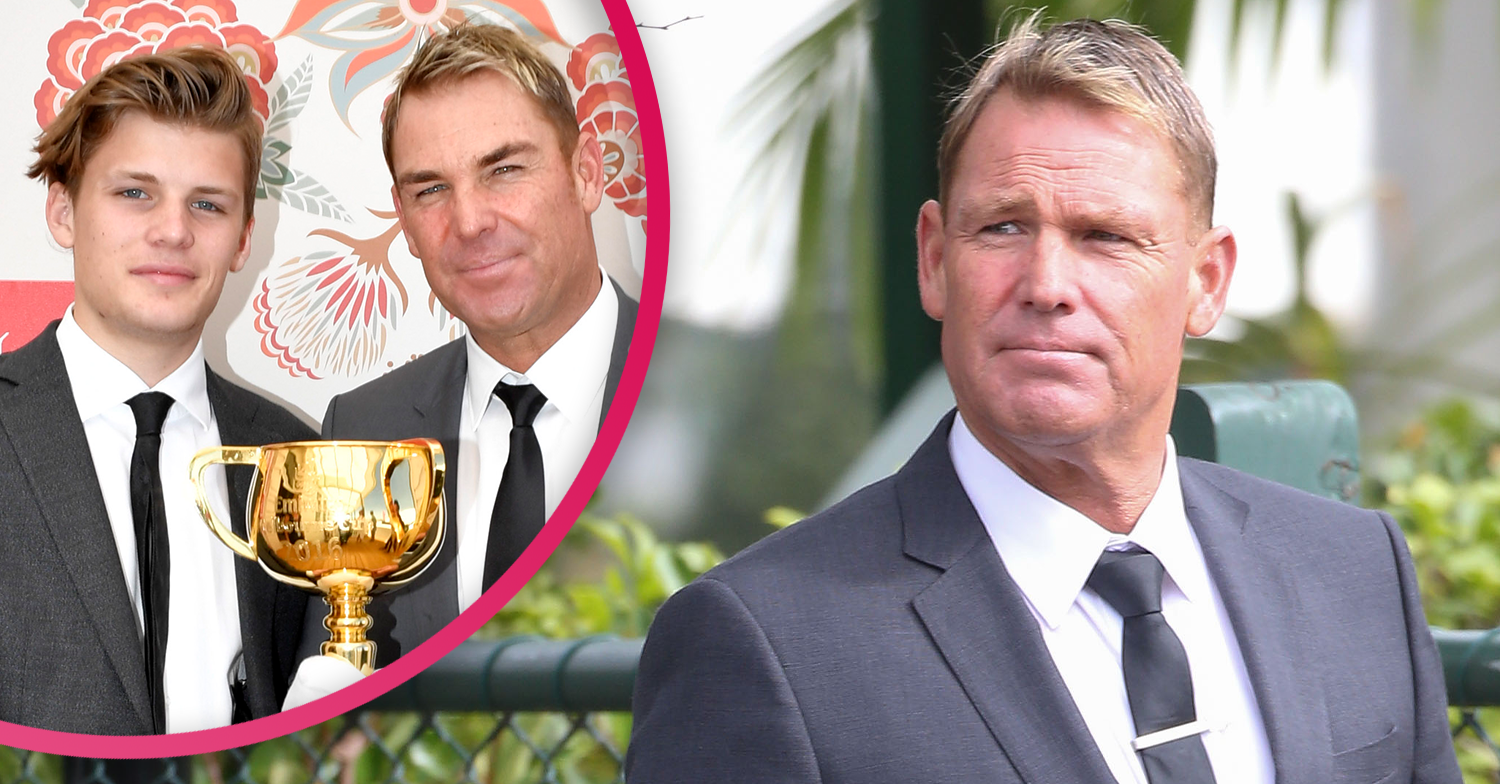 SHANE WARNE and his son with a trophy