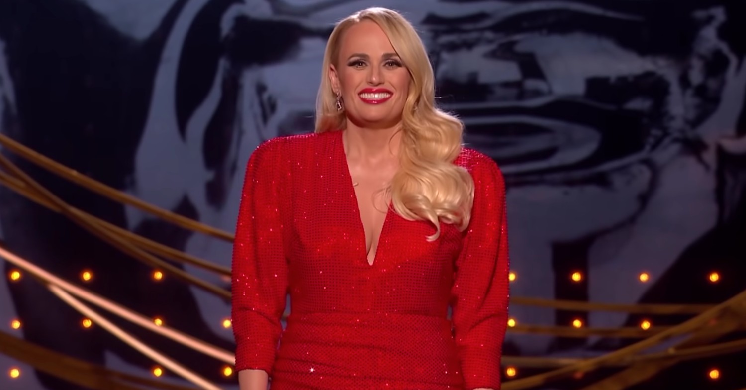 BAFTA 2022 host Rebel Wilson smiling at the awards