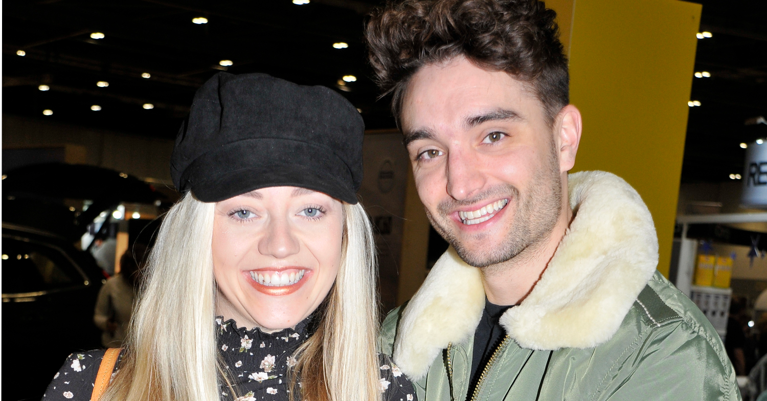 Tom Parker and his wife, Kelsey Hardwick, smiling for the camera in 2019 - prior to Tom's cancer battle
