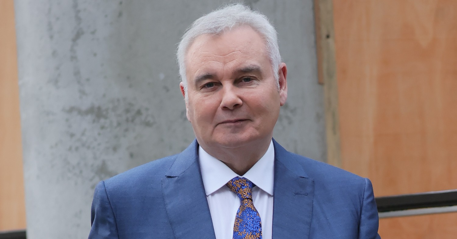 Eamonn Holmes smiling for the camera, wearing a blue suit
