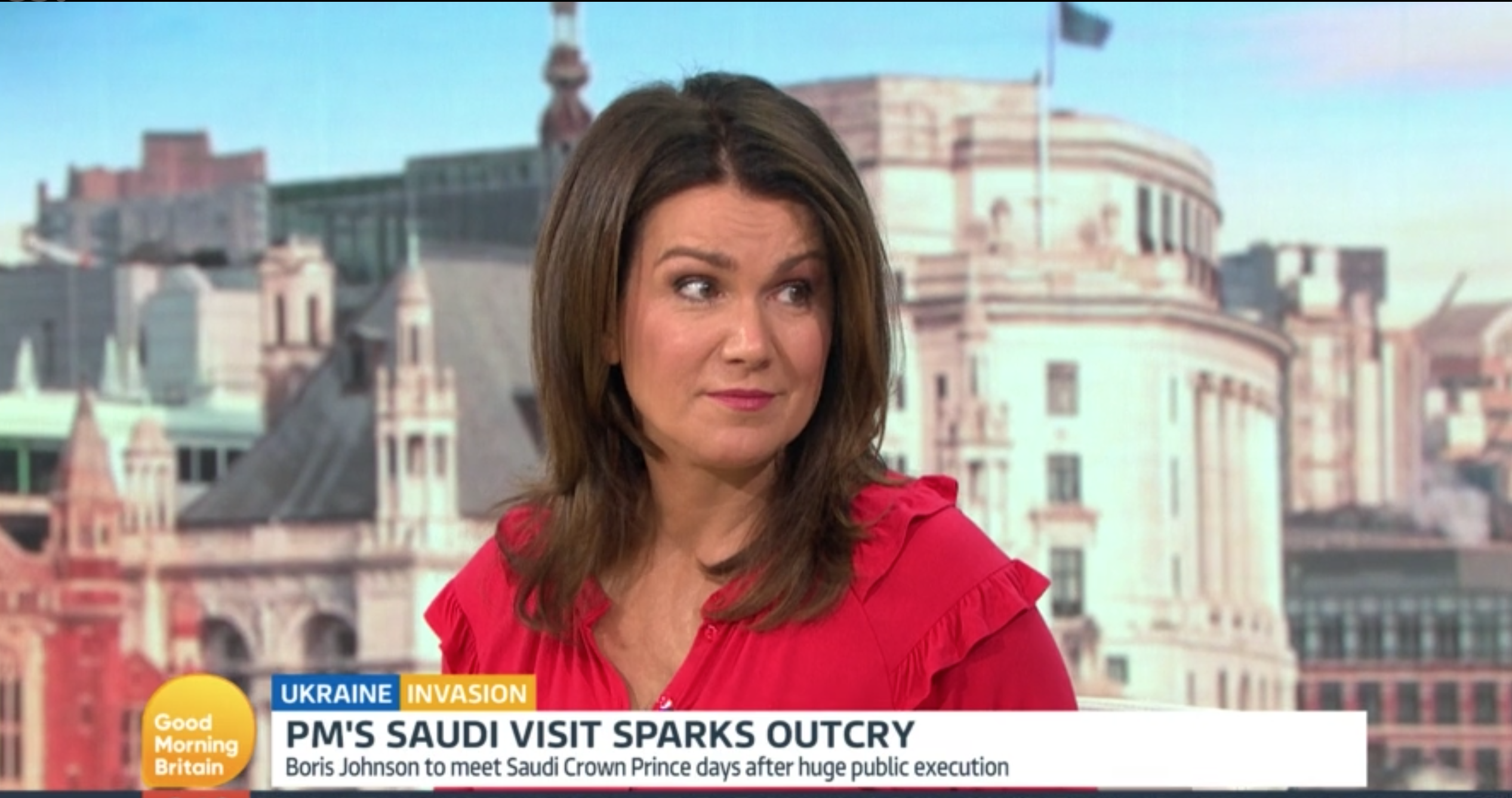 GMB host Susanna Reid looking puzzled wearing red