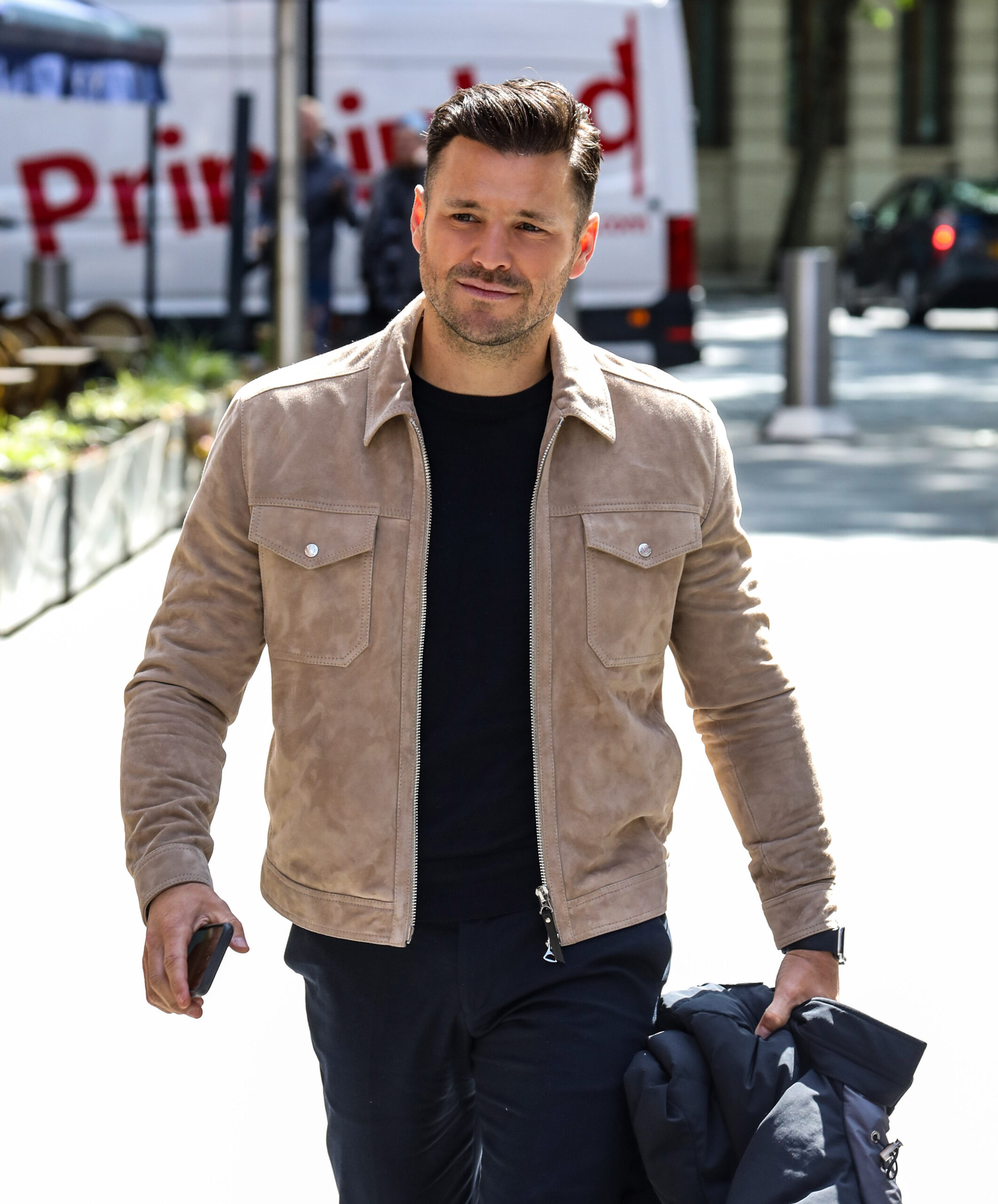 Mark Wright in a beige jacket