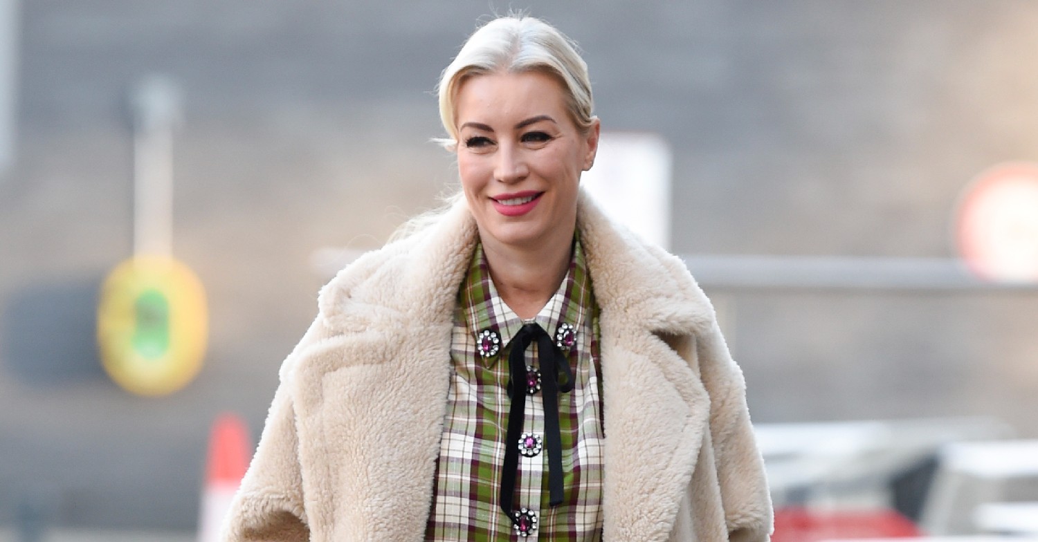 Denise Van Outen on a walk, smiling at cameras 