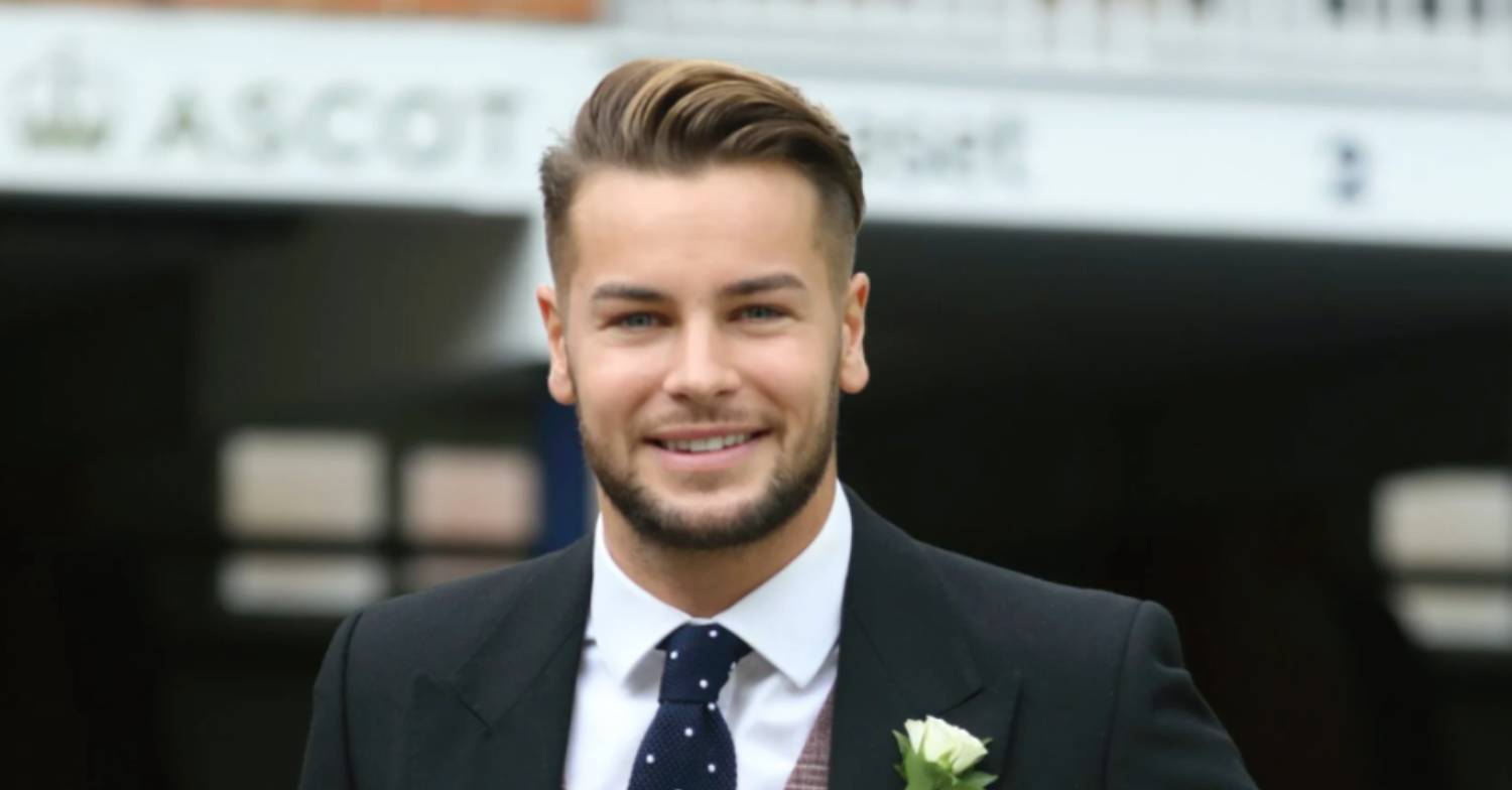 Chris Hughes in a suit and tie