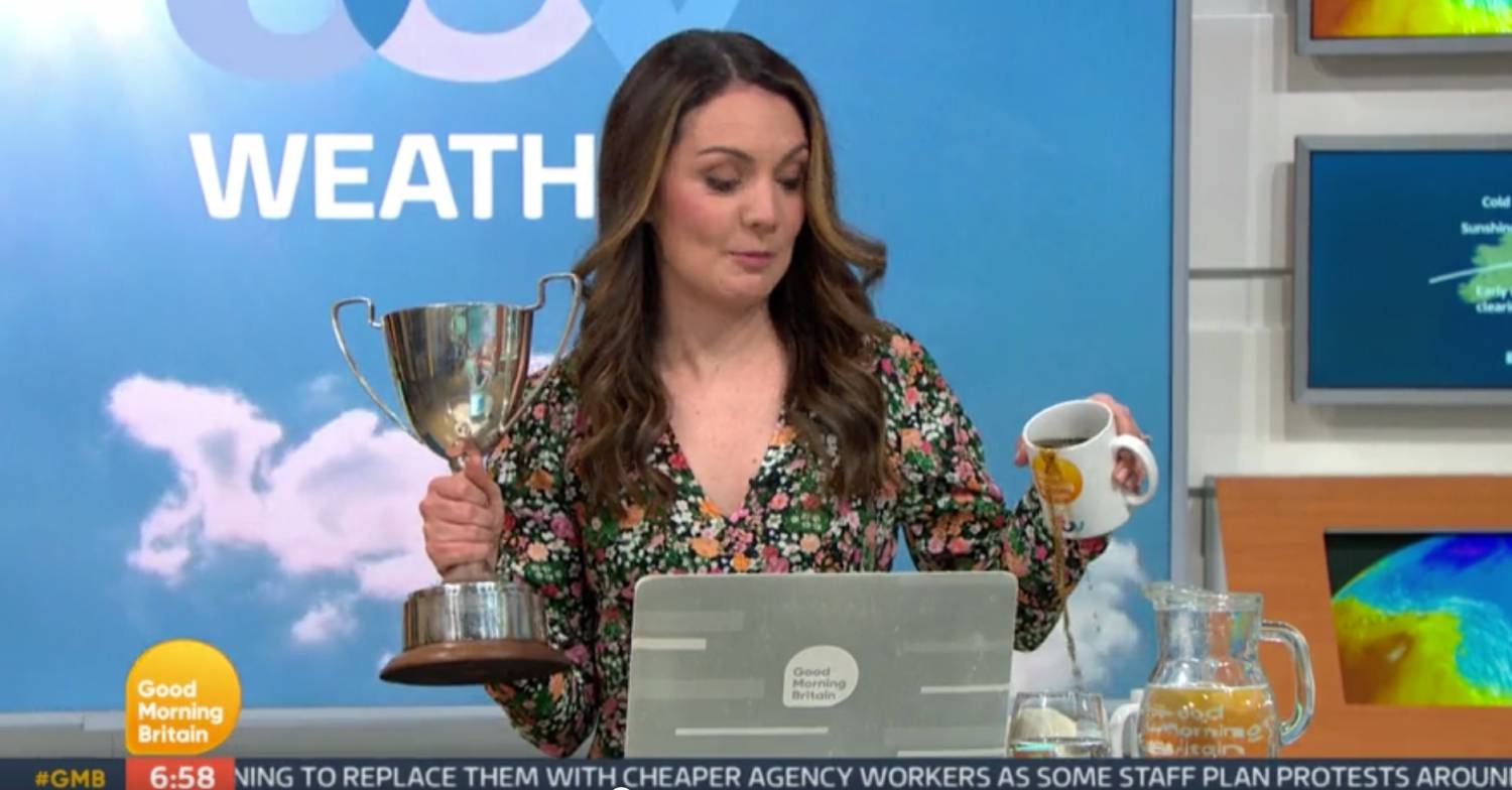Whoops! Laura tips her drink out of her GMB mug