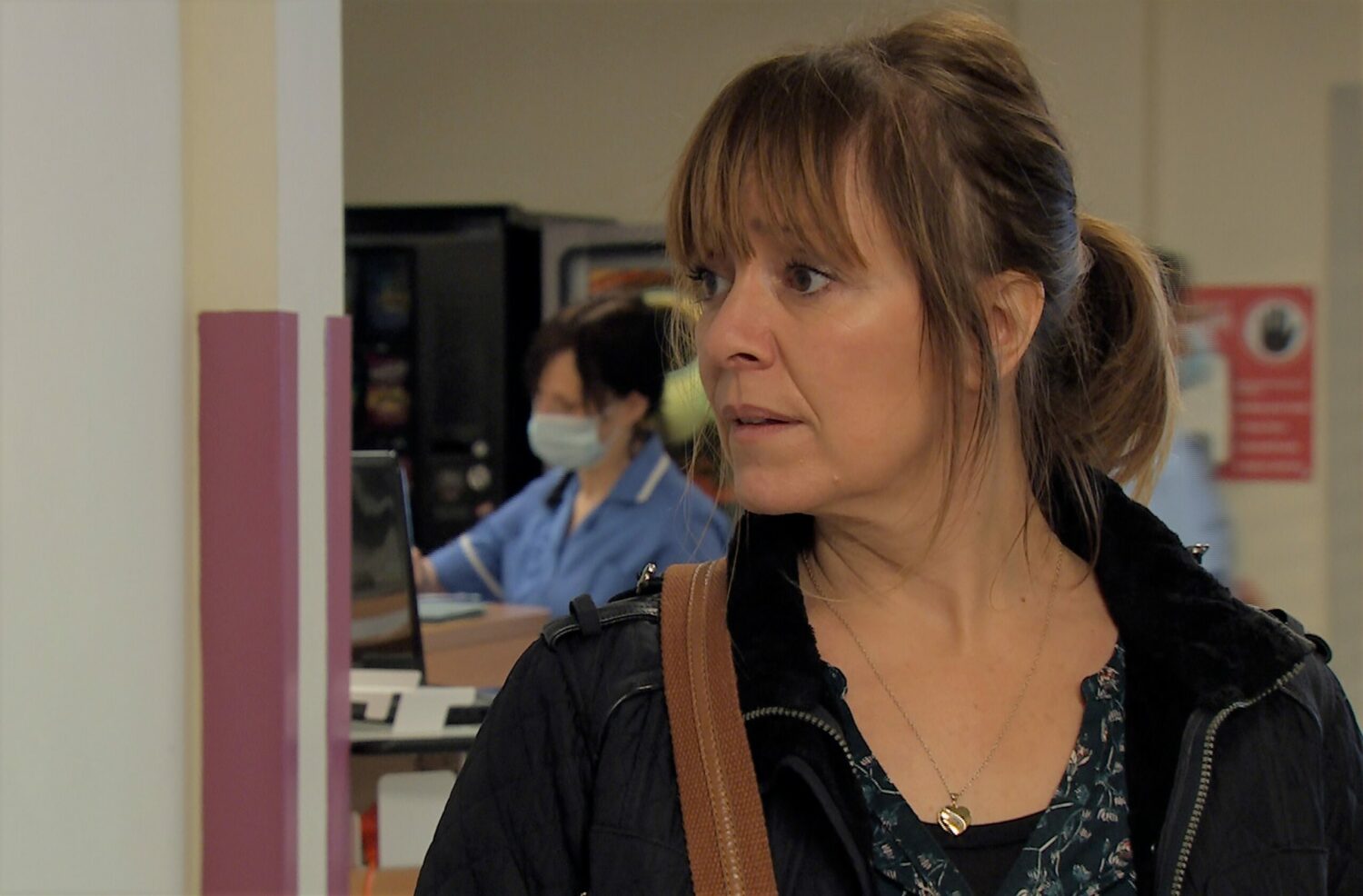 Rhona watches Marlon through his hospital window