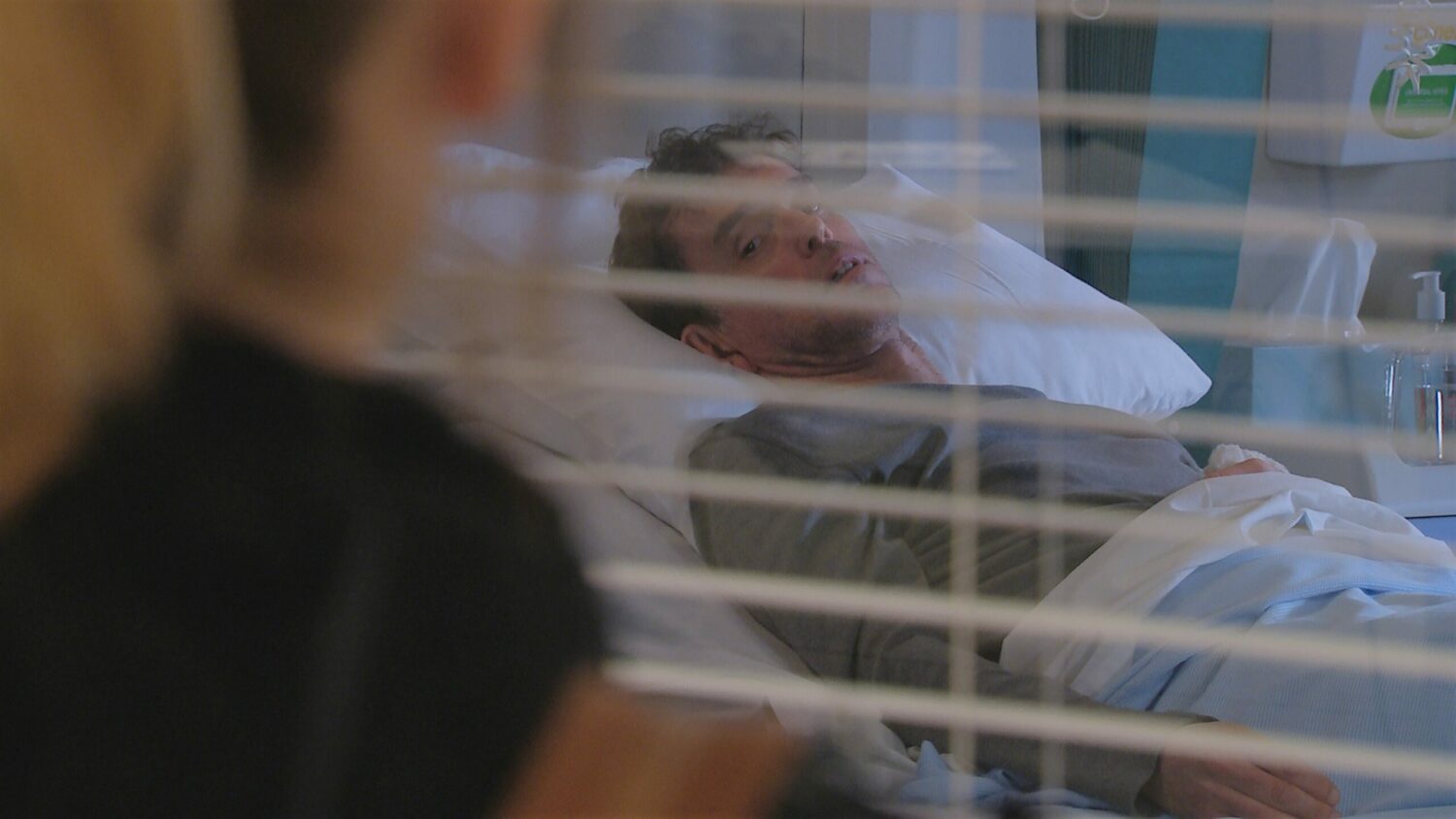 Rhona and Paddy watch Marlon in the hospital bed Emmerdale 