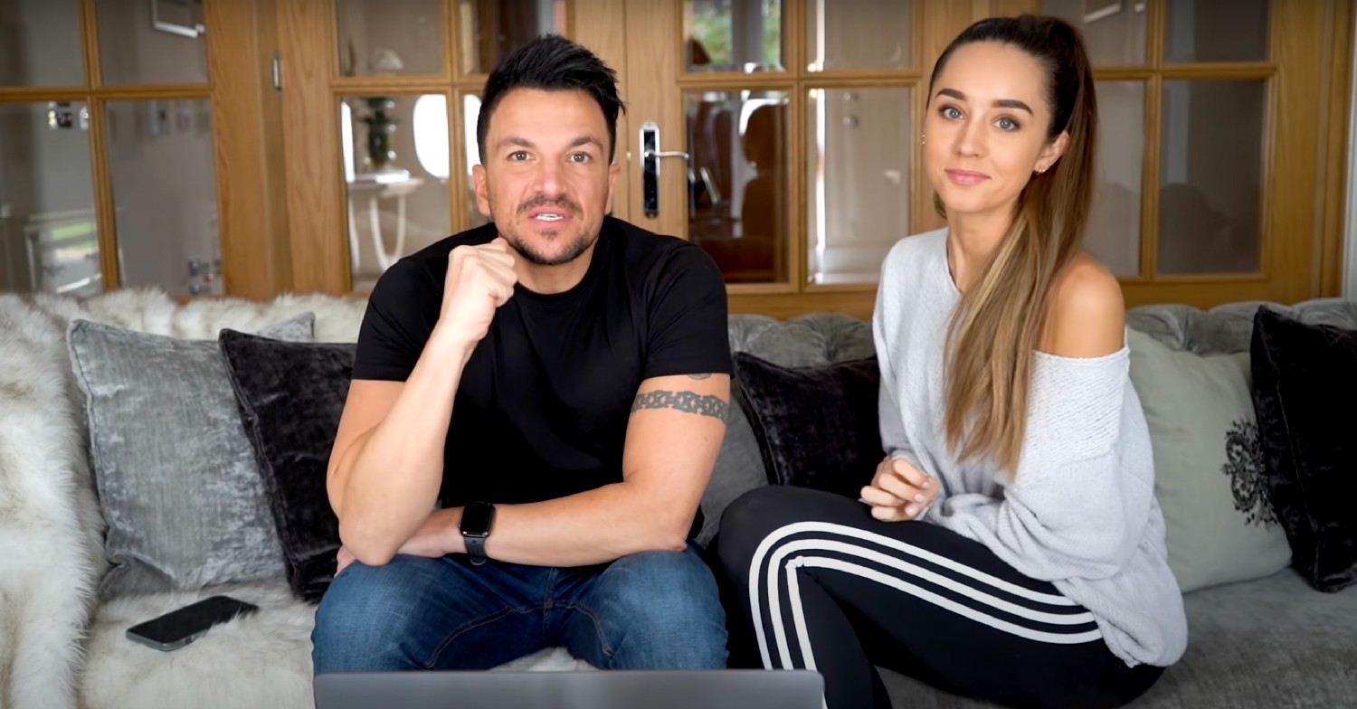 Peter Andre and wife Emily Andre speaking to camera, sitting on their sofa at home