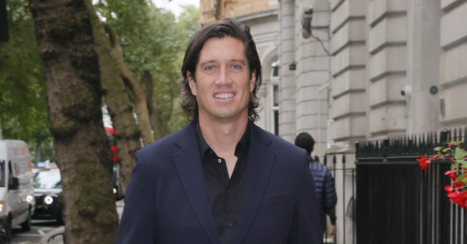Vernon Kay smiling at the cameras on a walk
