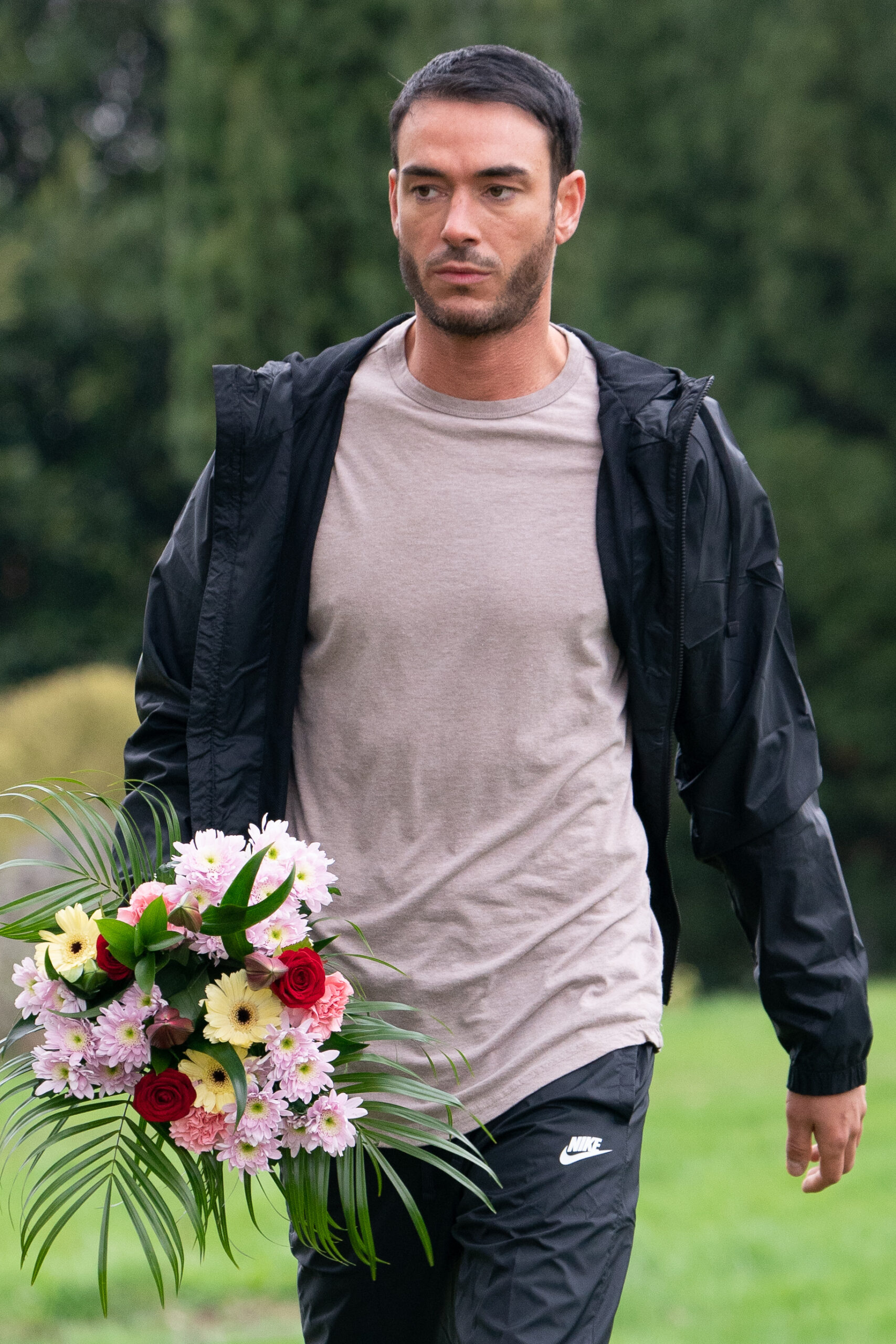 Jack Tweed carrying flowers