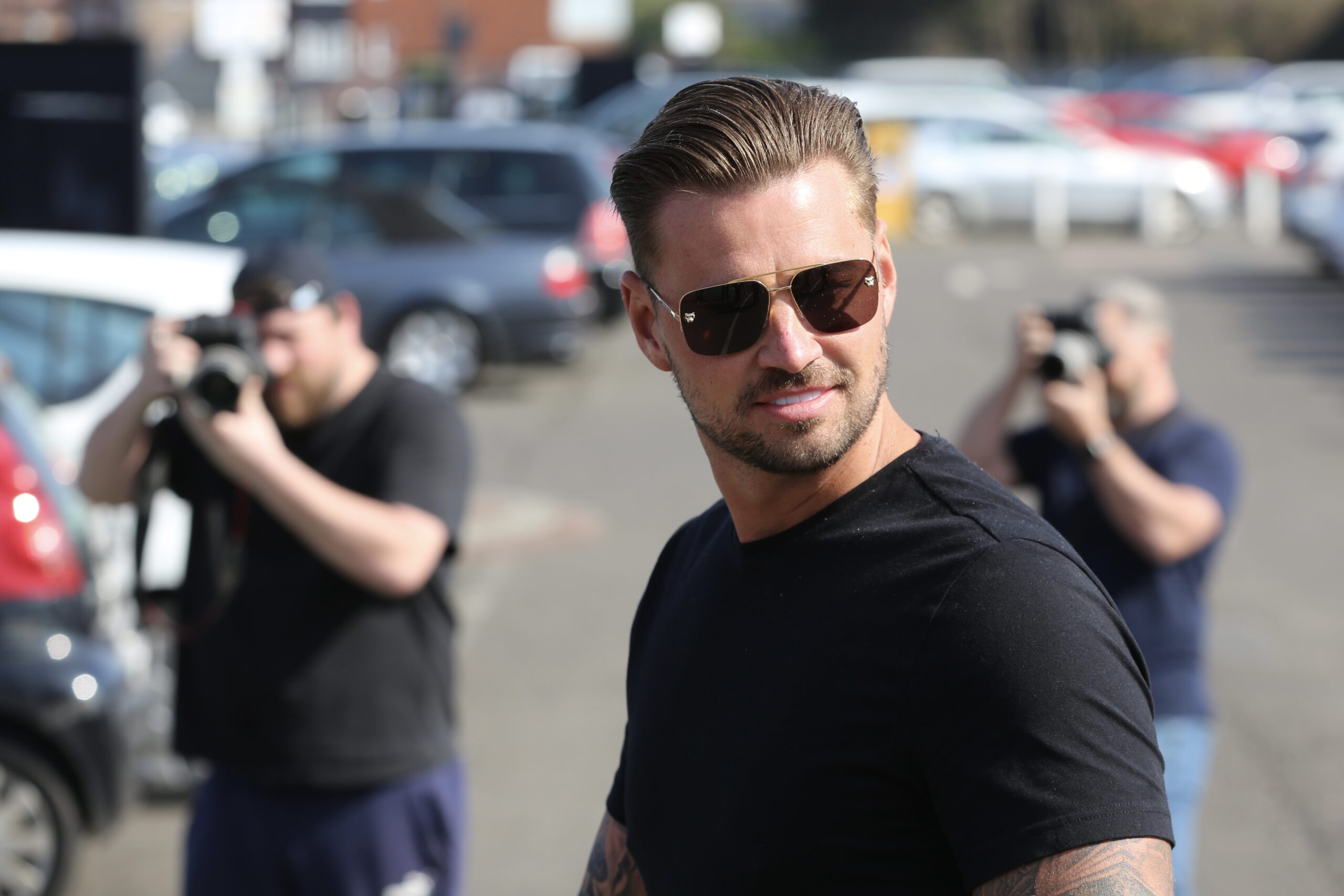 KATIE PRICE and Carl Woods leave court wearing sunglasses