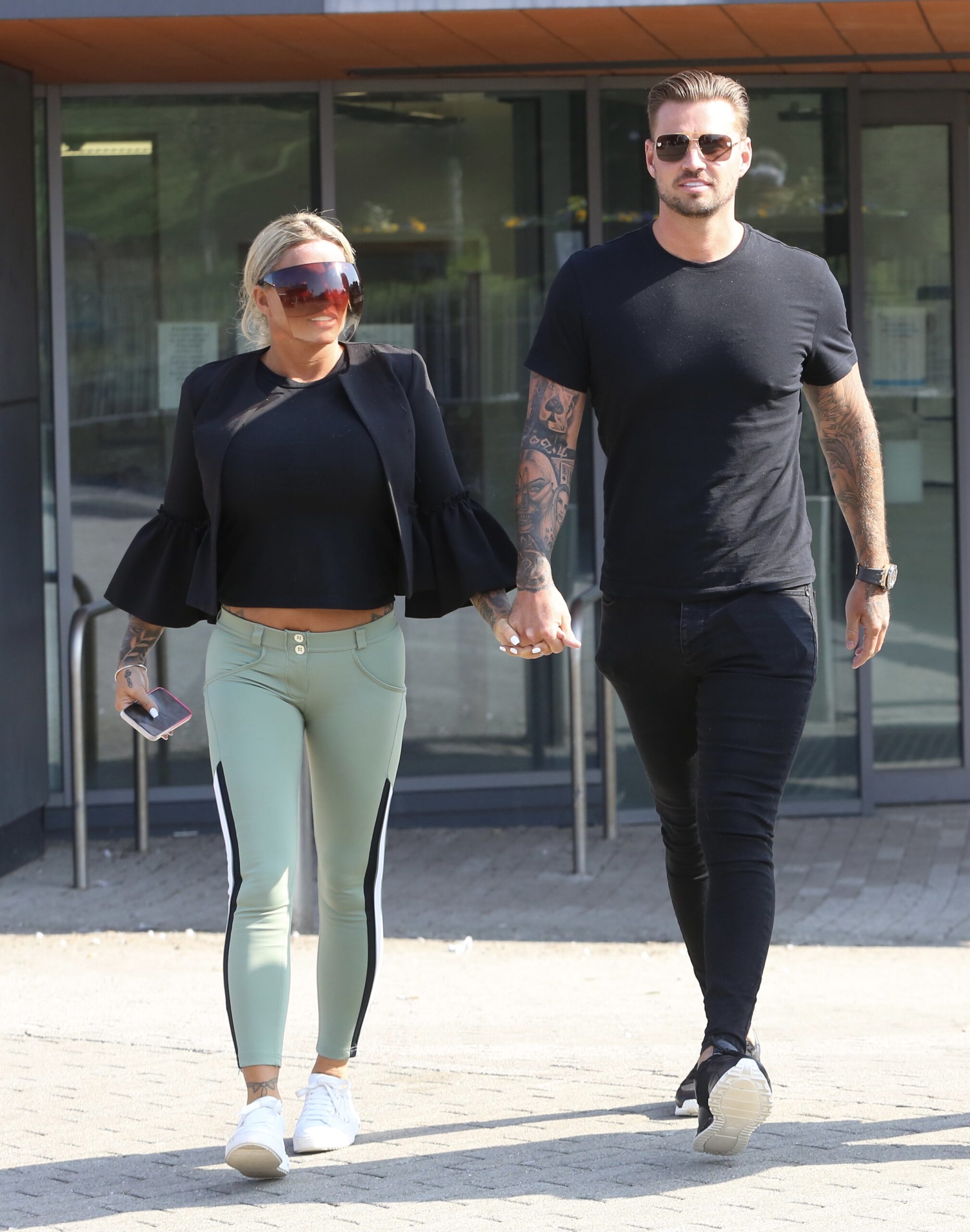 Carl Woods and Katie Price hand in hand