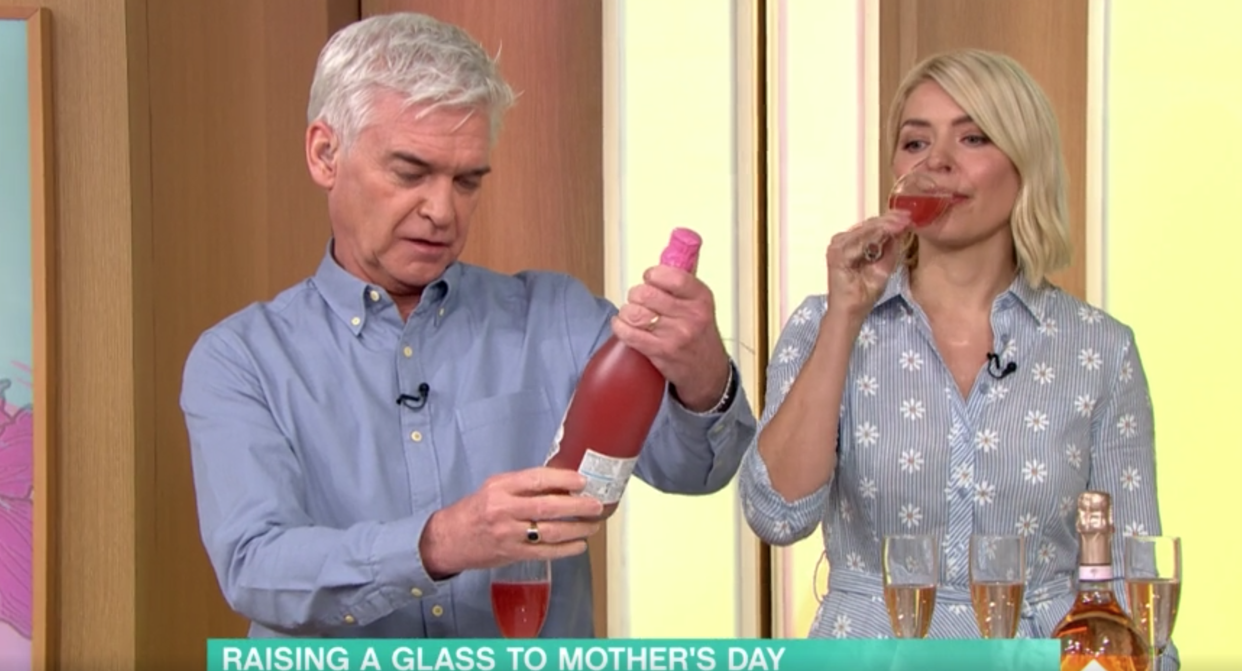 Phillip and Holly drinking wine on This Morning today
