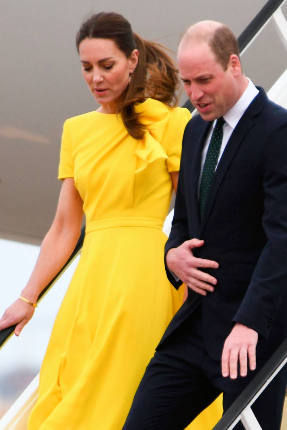Prince William and Kate stepping off a plane