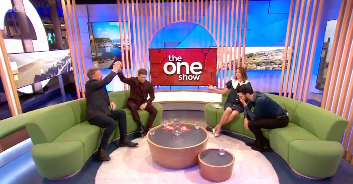 A high five between Gordon and Michael Buble on The One Show