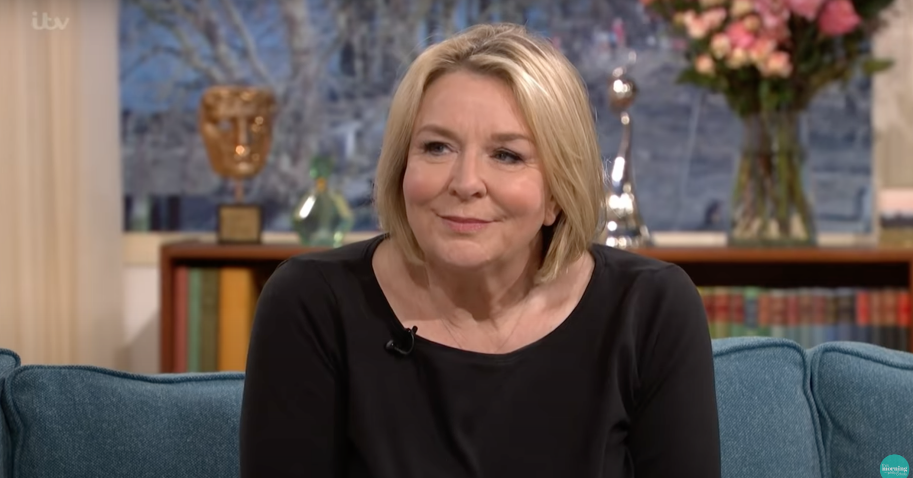 Fern Britton smiling weakly on the This Morning sofa