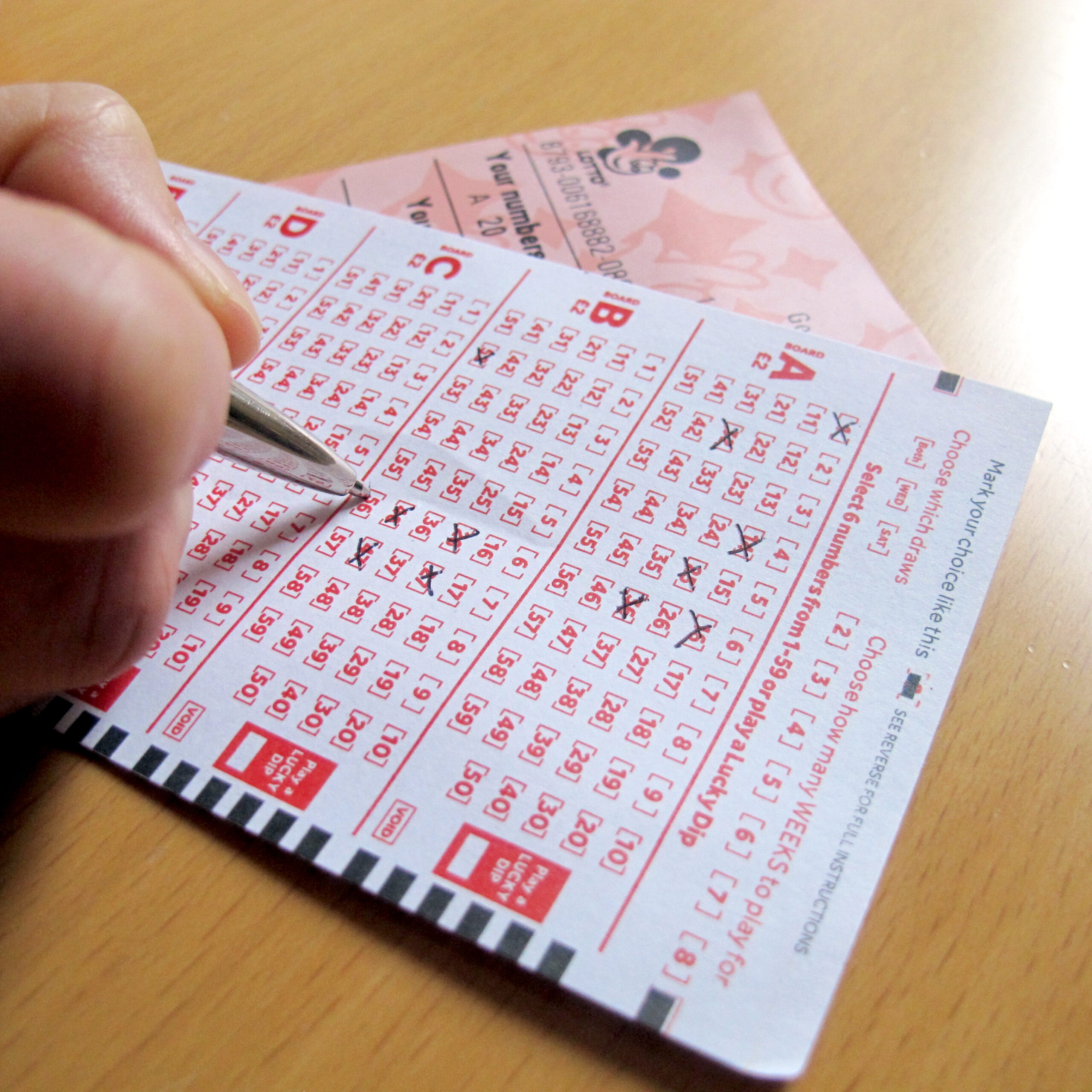 Person filling out their lottery ticket