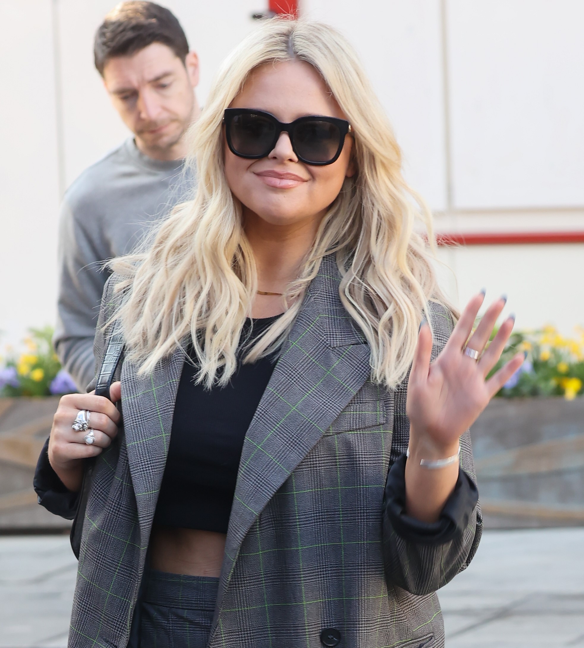 Emily Atack waves to cameras at Heart radio