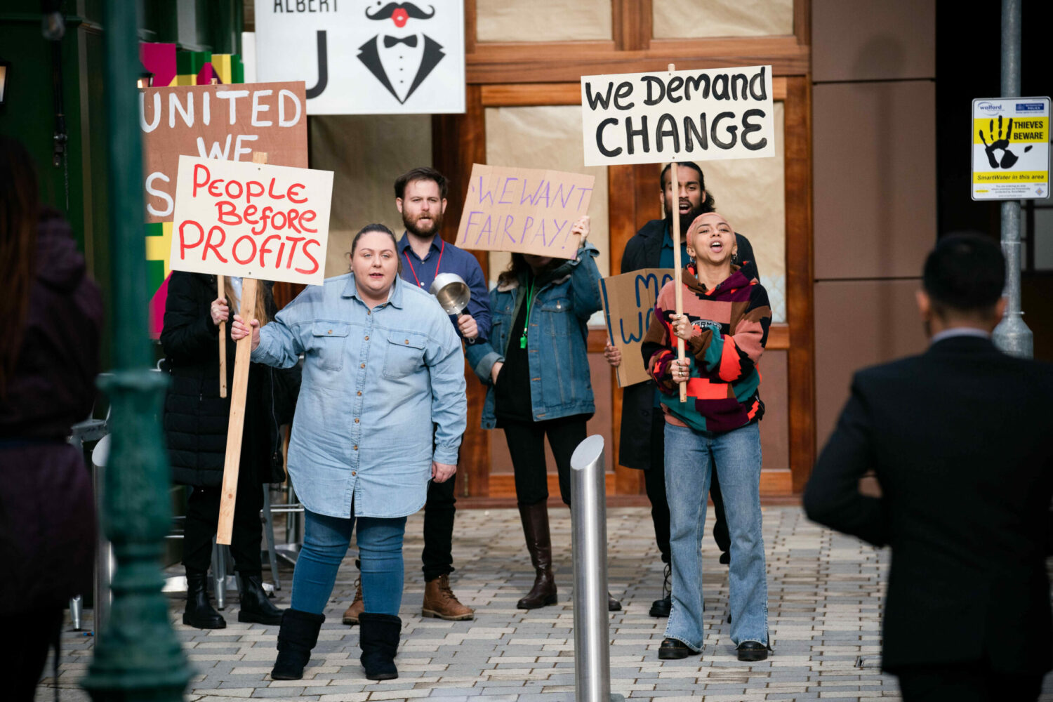 Bernie leads the workers in a protest in EastEnders
