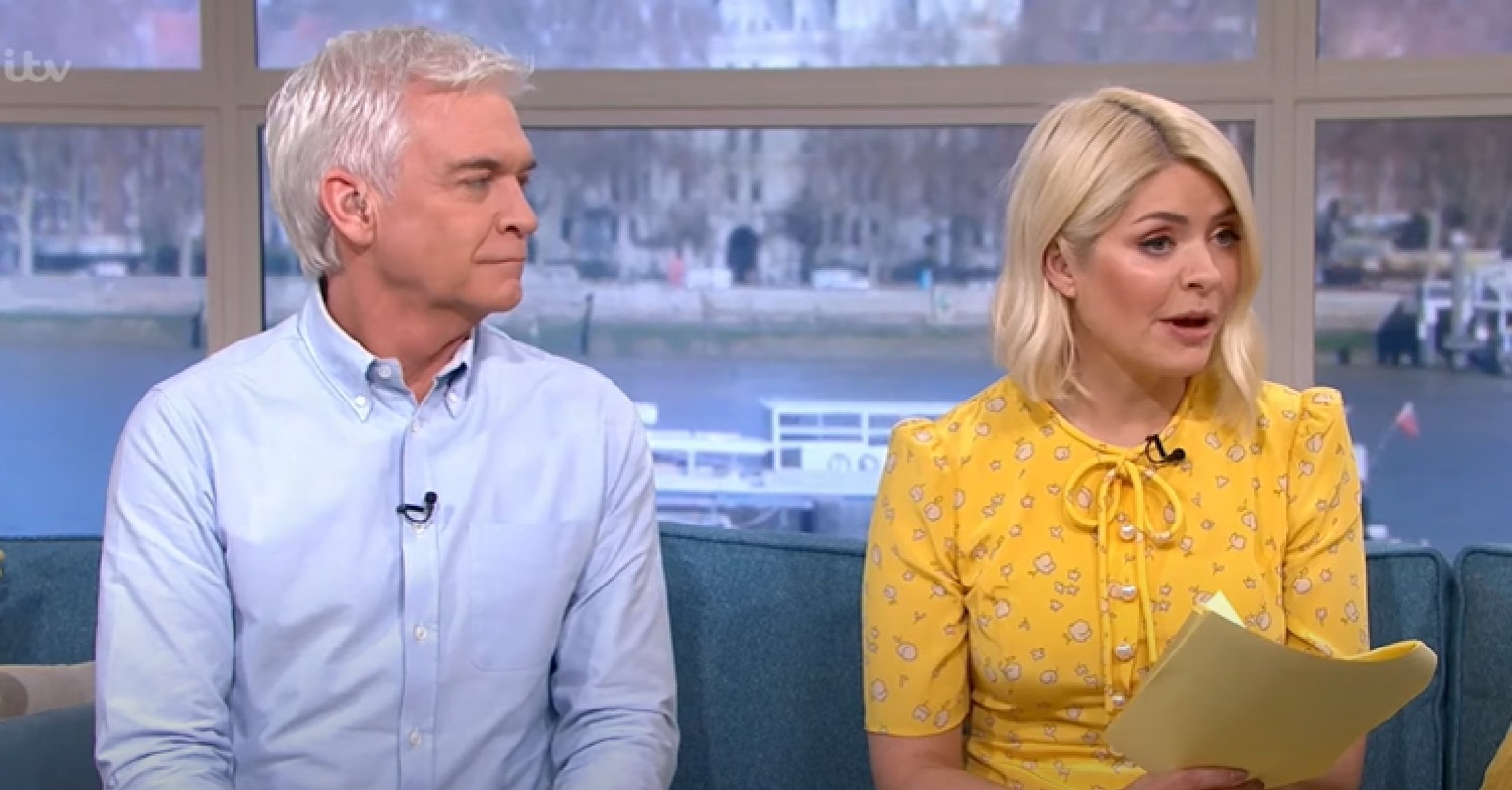 Phillip Schofield looks at Holly Willoughby who's wearing yellow dress on This Morning today