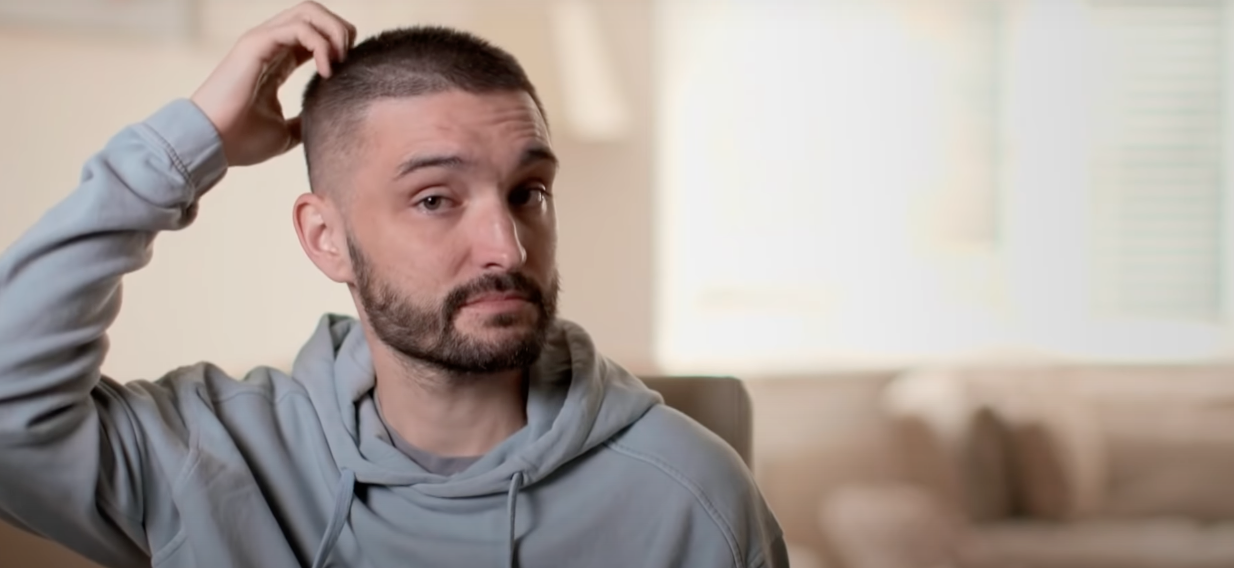 Tom Parker looking sad