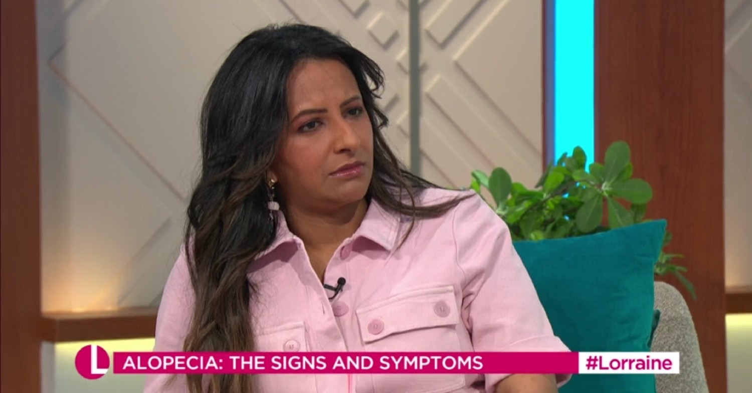 Ranvir Singh wearing a pink dress, looking concerned on Lorraine 