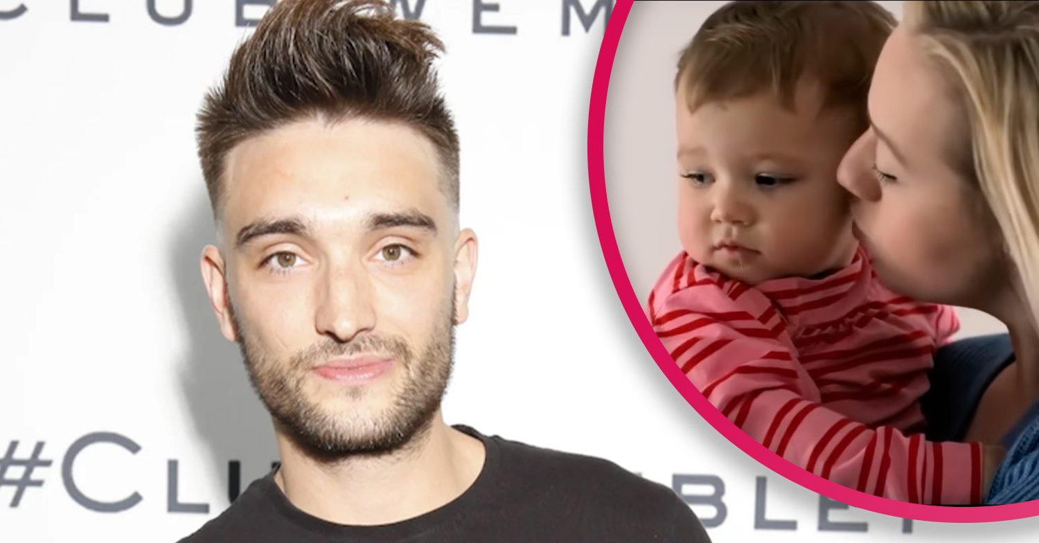 The Wanted's Tom Parker smiling and his wife holding their baby