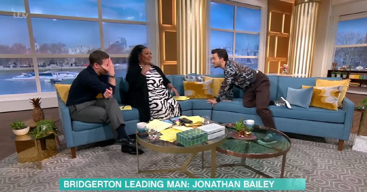 Jonathan Bailey leans over to Alison Hammond on This Morning