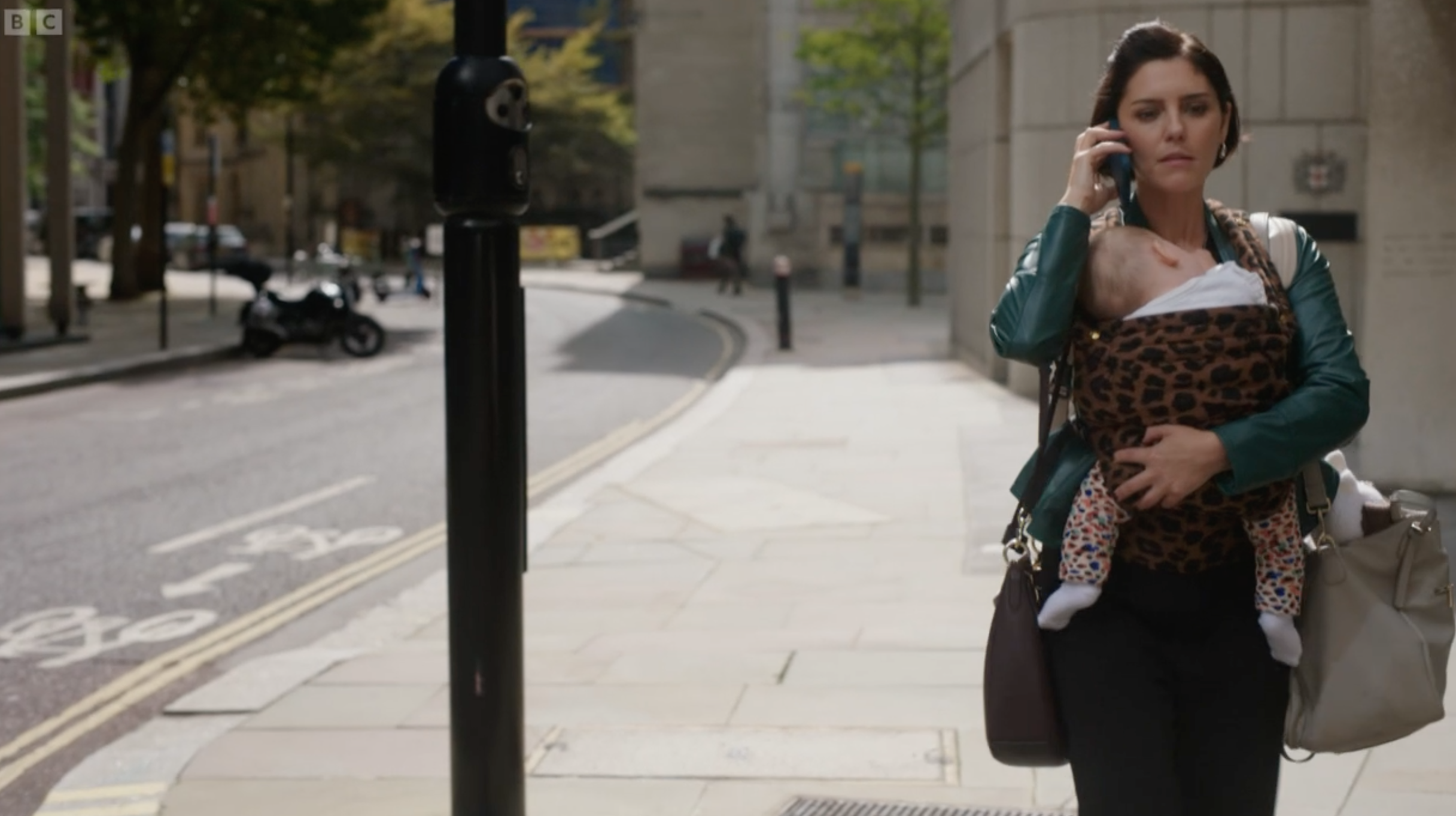 Nina from The split carrying her baby