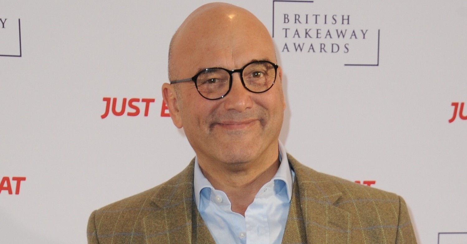Gregg Wallace smiles in biege suit and shirt