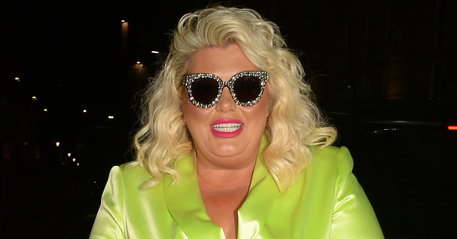 Gemma Collins wearing a bright green suit and sunglasses while on tour