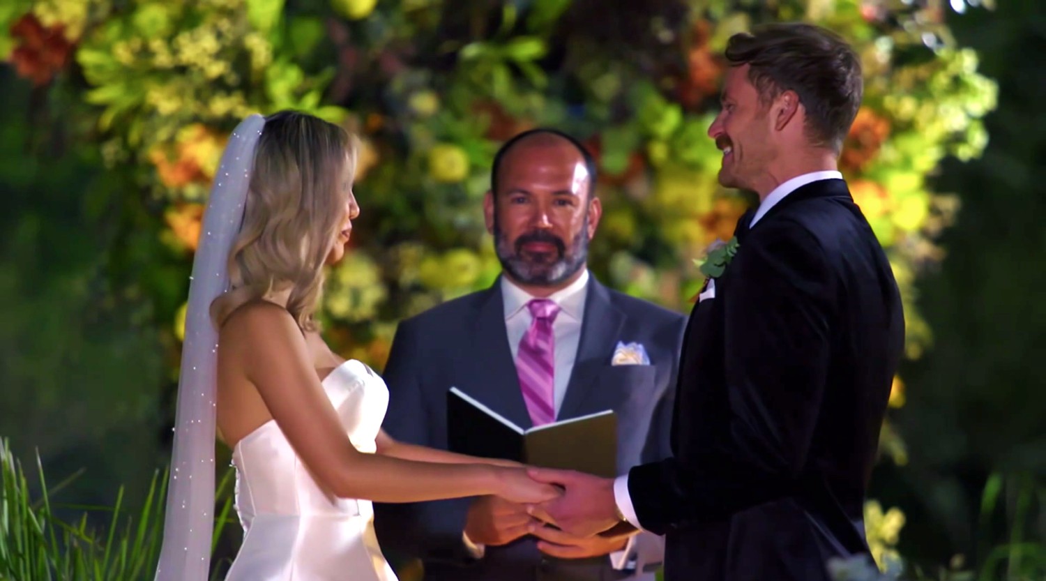 Selina and Cody smiling at their wedding ceremony