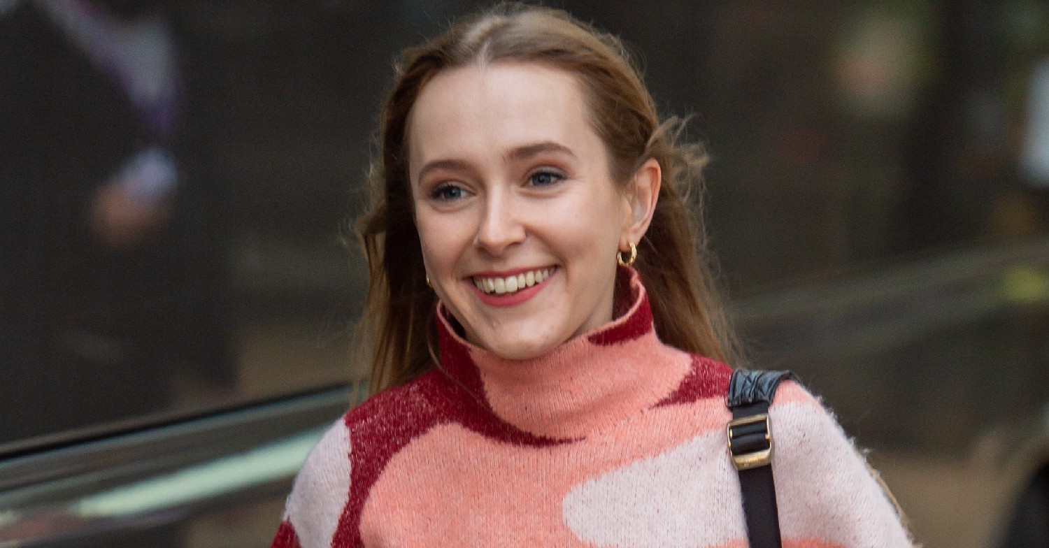 Rose Ayling-Ellis, wearing a patterned turtle-neck, smiling
