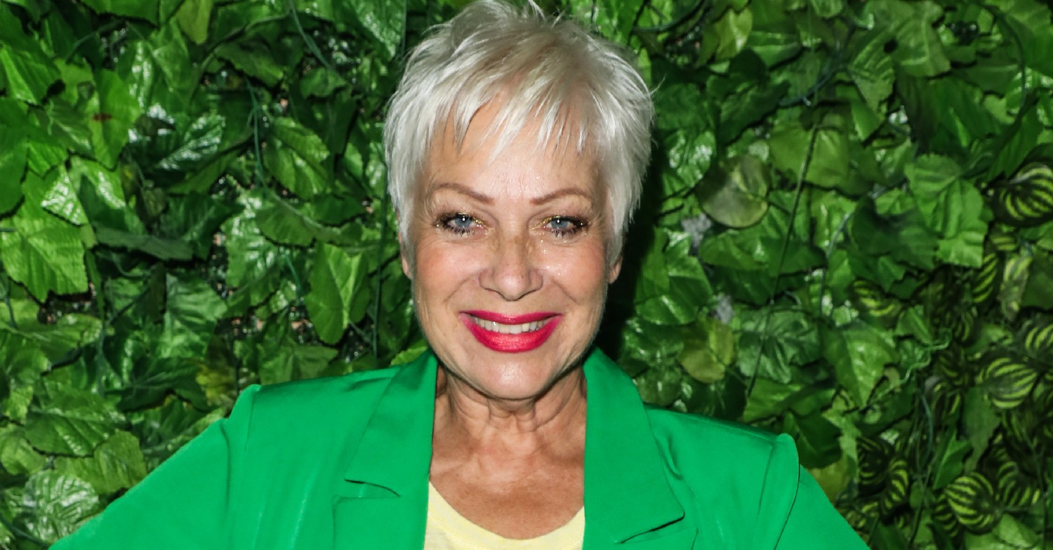 Denise Welch smiles in green outfit at event