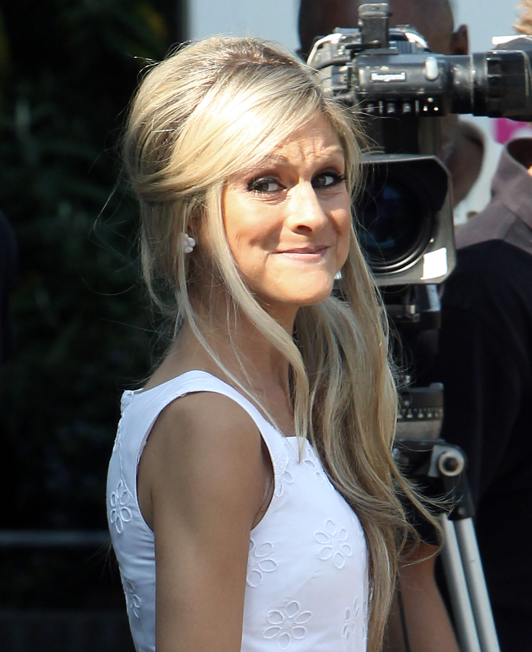 Nikki Grahame wearing white smiling