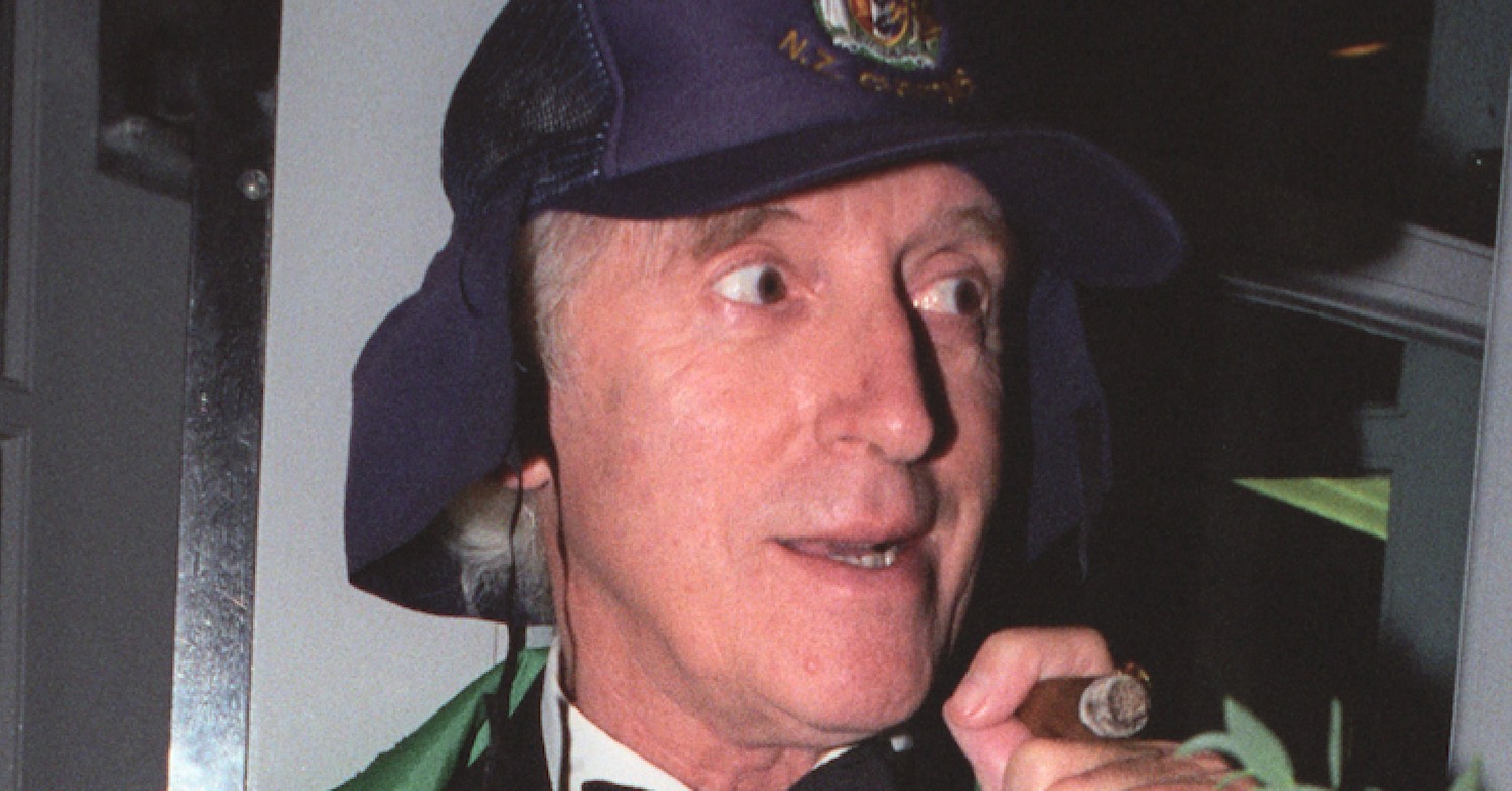 Jimmy Savile - subject of Jimmy Savile: A British Horror Story - smiling shiftily in a pap shot