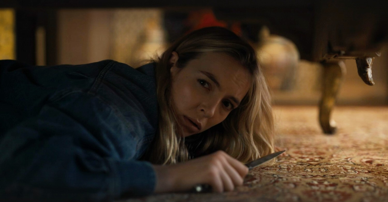 Villanelle hiding under the bed in Killing Eve