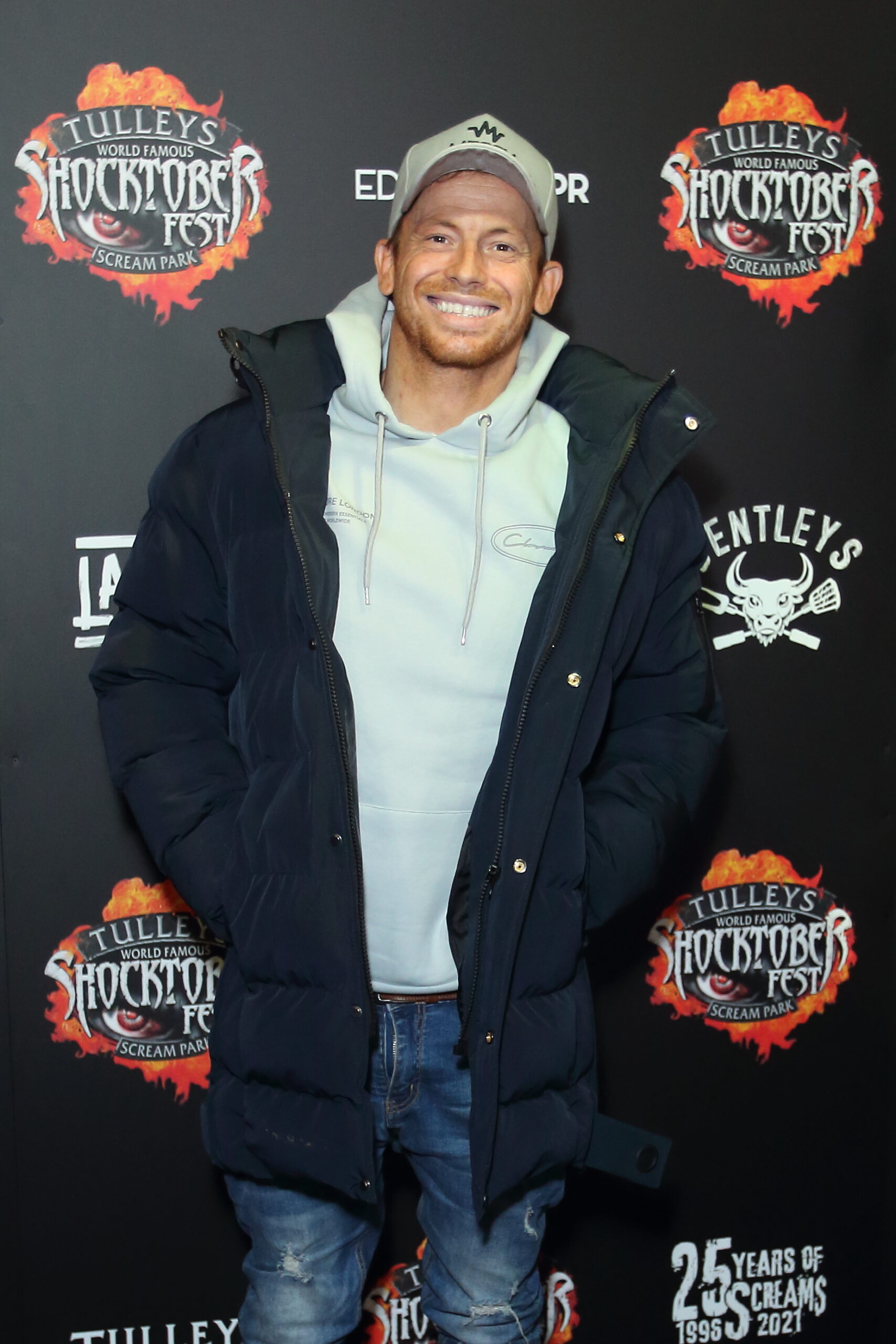 Joe Swash smiling on the red carpet