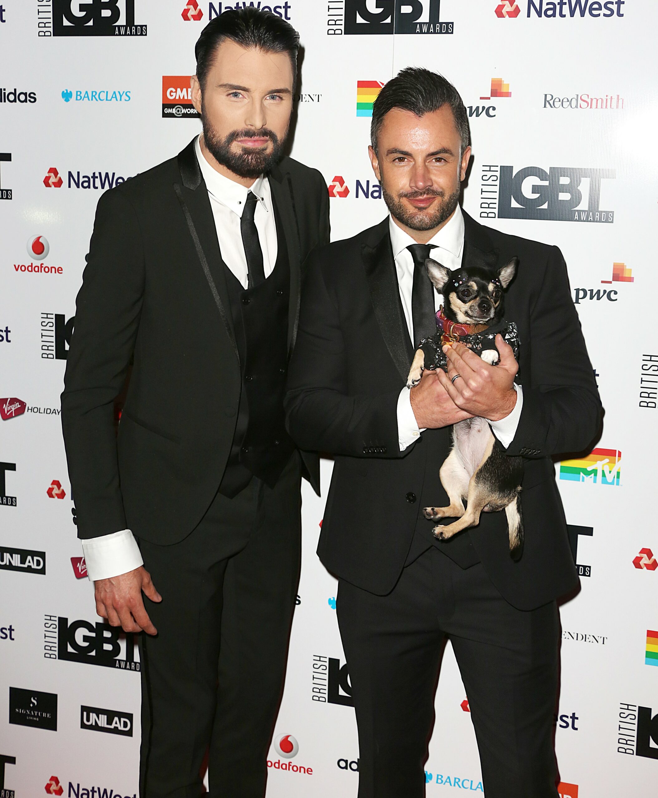 Rylan Clark and Dan Neal in suits at the LGBT Awards