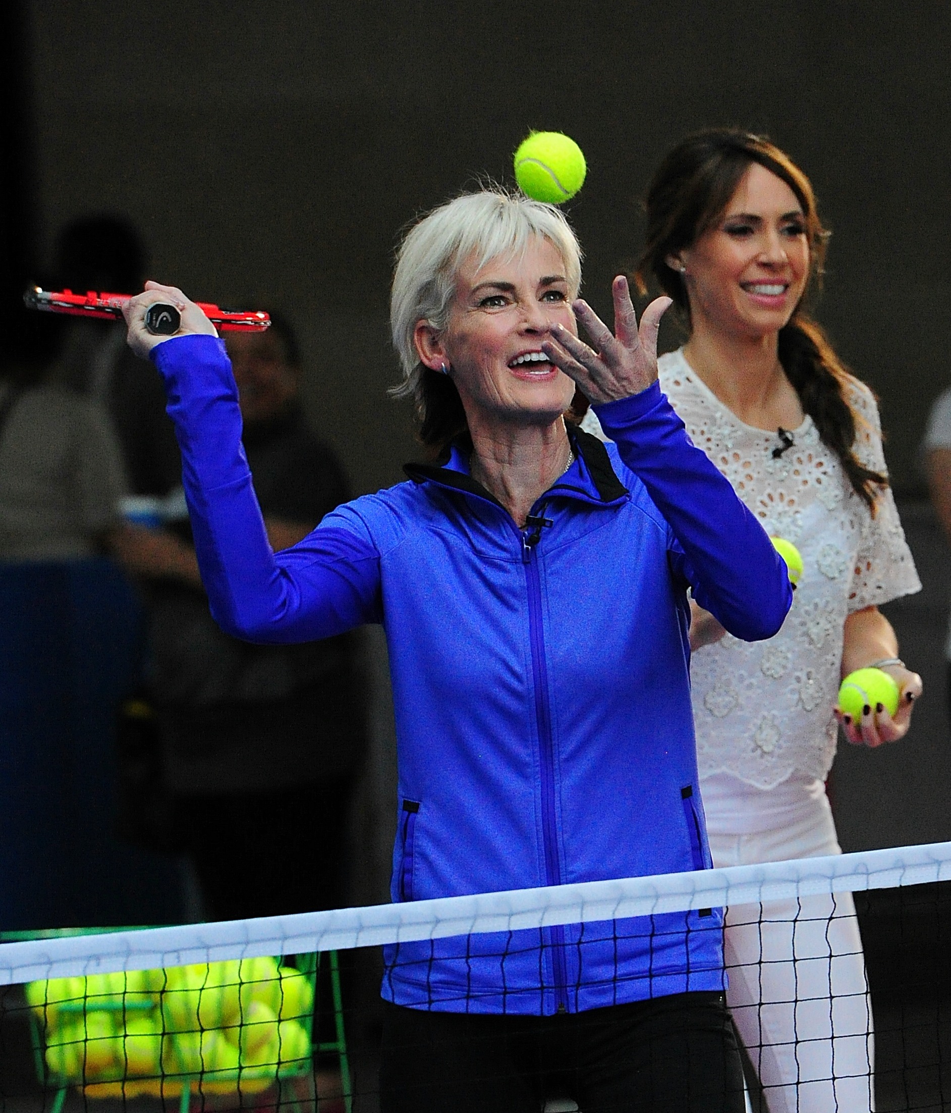 Judy Murray grinning as she plays tennis