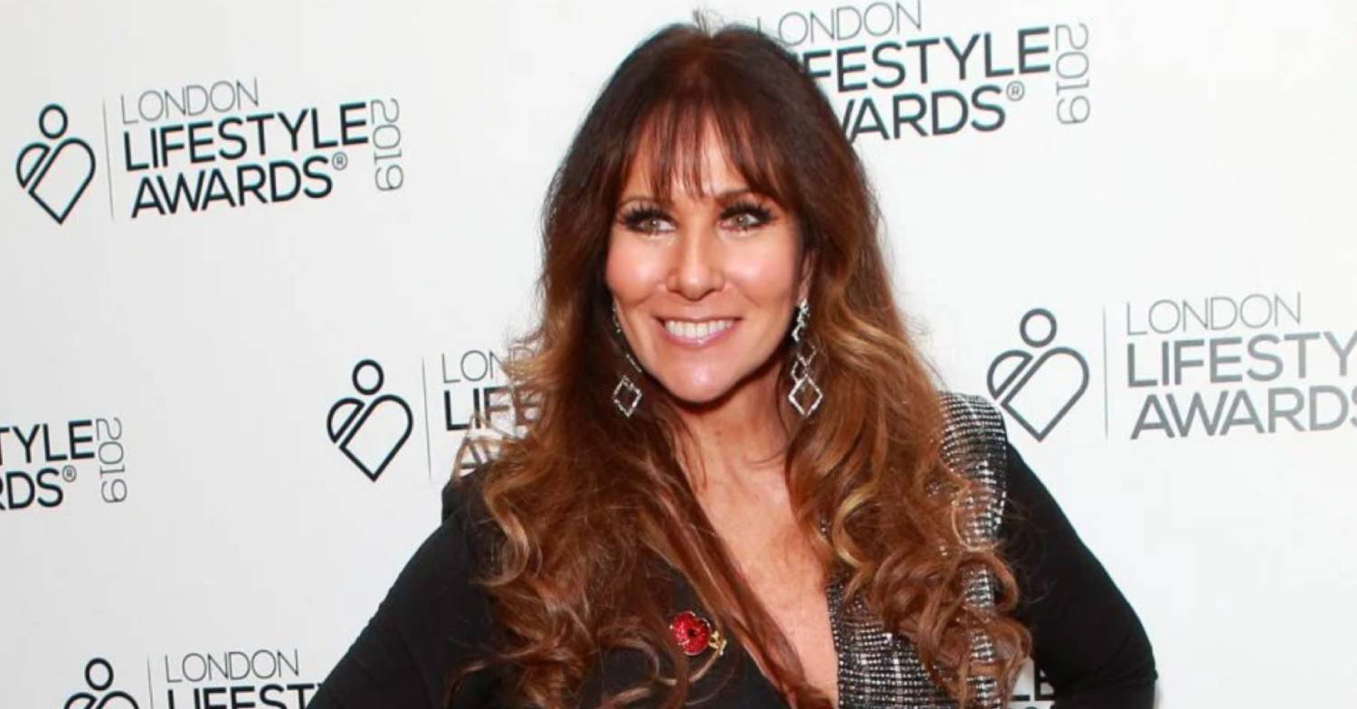Linda Lusardi smiling for cameras at an awards show